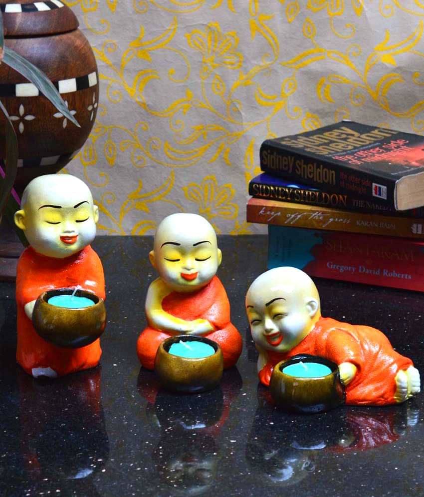     			eCraftIndia Set of 3 Monks Candle Holder - Orange