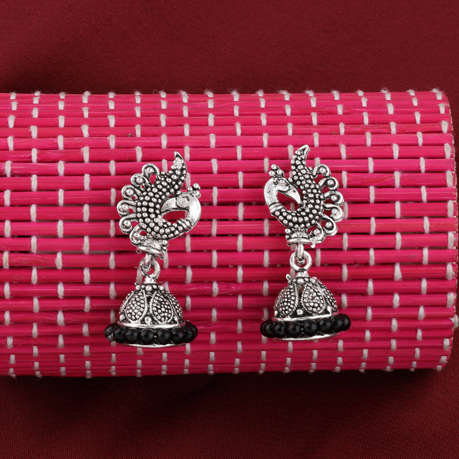     			Silver Shine Alluring Yellow Beads in Peacock Shape Jhumki Earrings