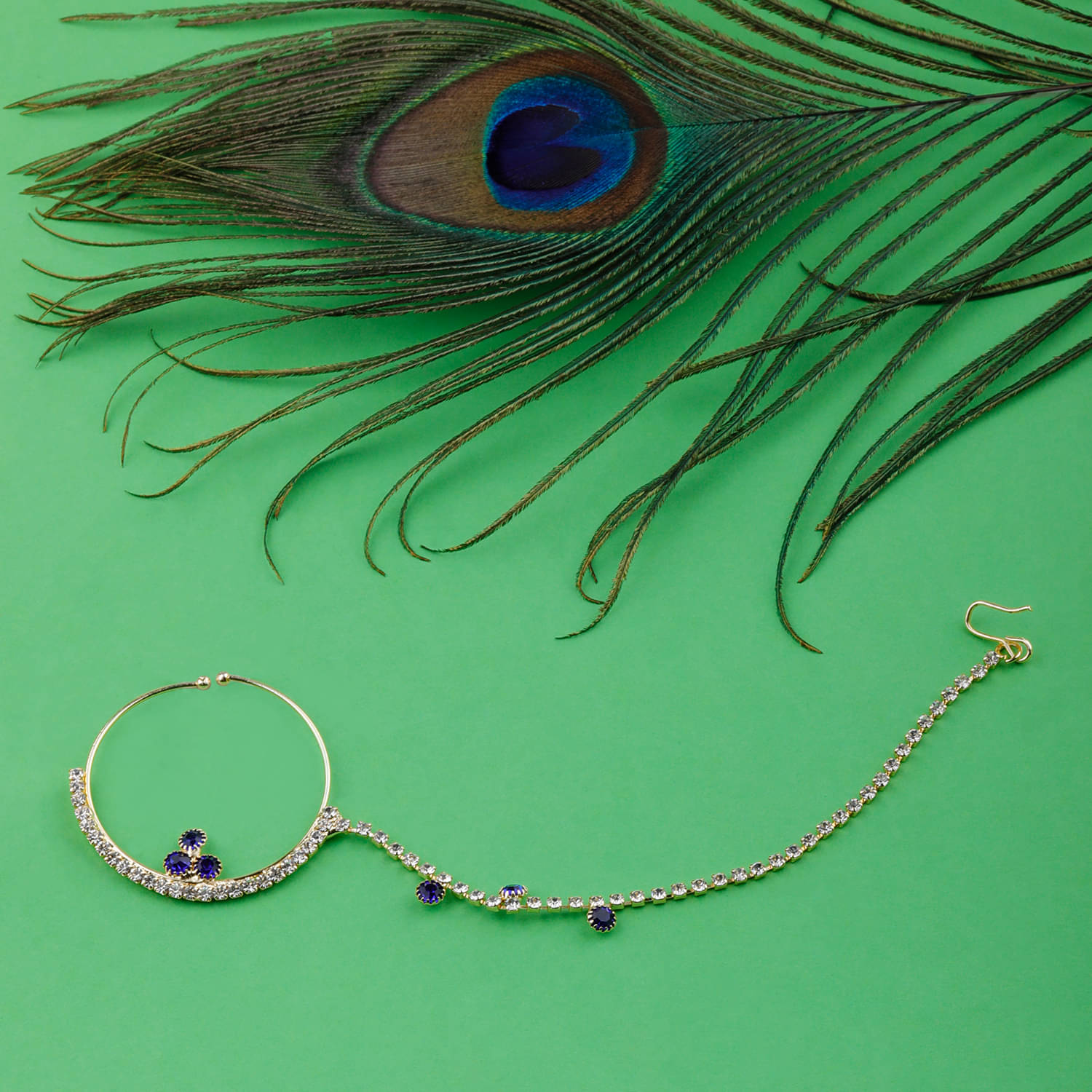 Silver Shine Traditional Gold Plated Elegant One line Chain Royal Blue Diamond Studded Designer Wedding Nose Ring For Girls And Women Jewellery     			Silver Shine Traditional Gold Plated Elegant One line Chain Royal Blue Diamond Studded Designer Wedding Nose Ring For Girls And Women Jewellery
