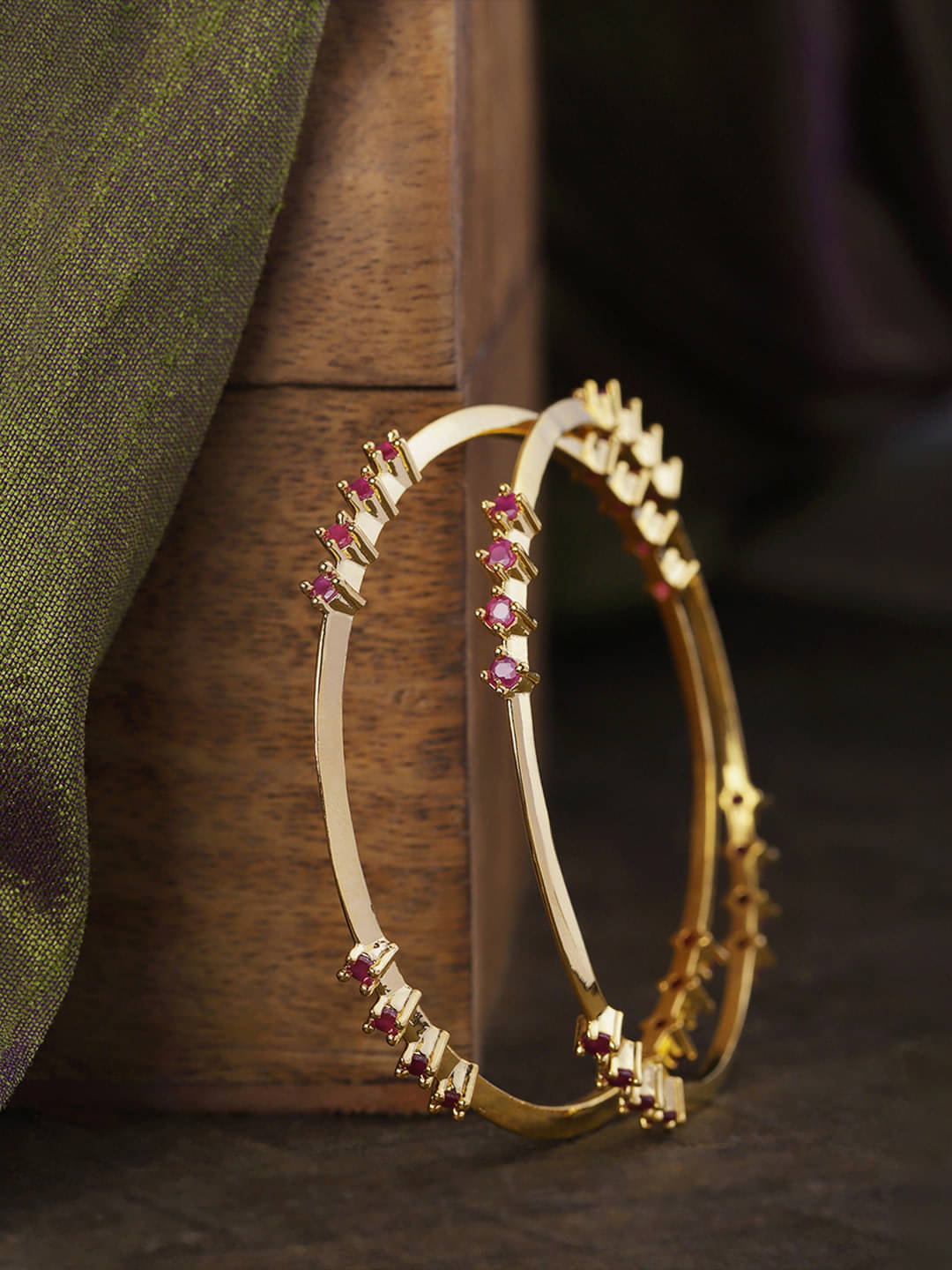 Priyaasi Set Of 2 Gold Plated Ruby Studded Lightweight Bangles Priyaasi Set Of 2 Gold Plated Ruby Studded Lightweight Bangles