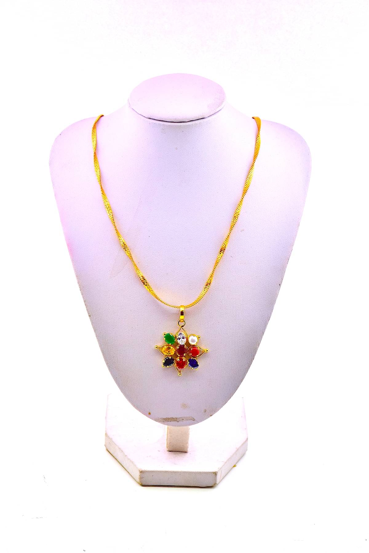     			Rudradivine Multicolour Synthetic Brass Navratan Navgrah Flower Shape Locket Pendant for Women