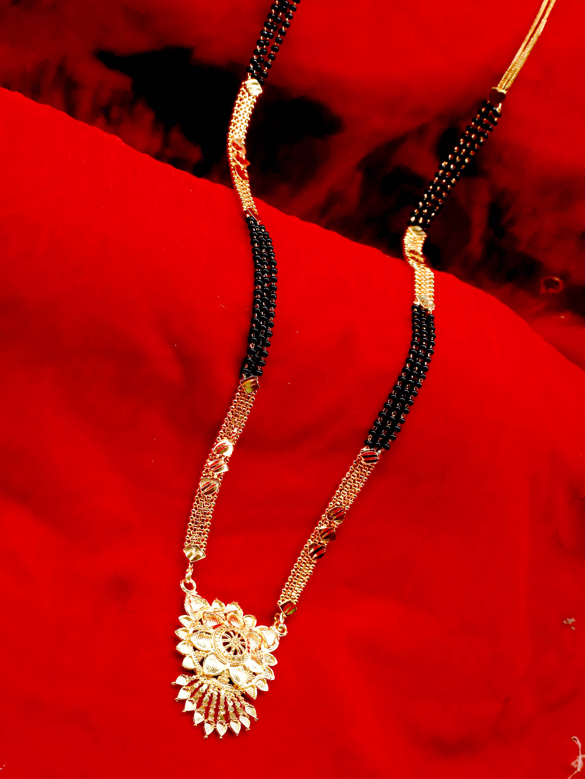     			shankhraj mall gold plated black bead long mangalsutra for women-100139