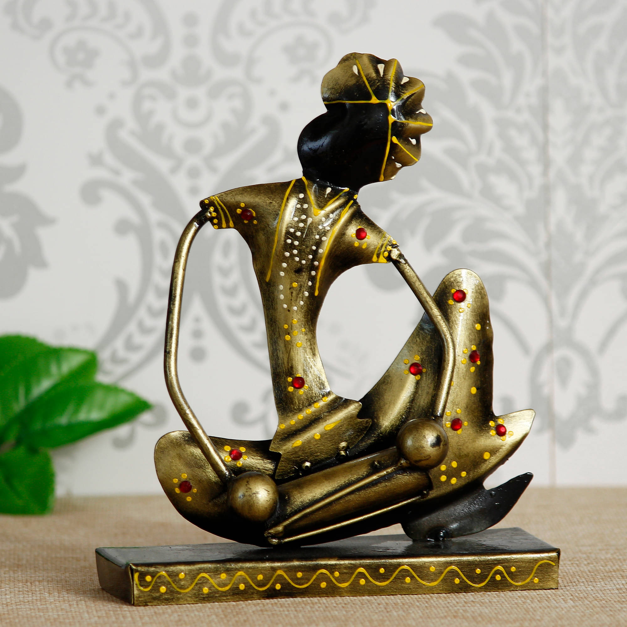 eCraftIndia Gold-Toned & Black Tribal Man with Pagdhi Playing Musical Instrument Dholak Decorative Showpiece     			eCraftIndia Gold-Toned & Black Tribal Man with Pagdhi Playing Musical Instrument Dholak Decorative Showpiece