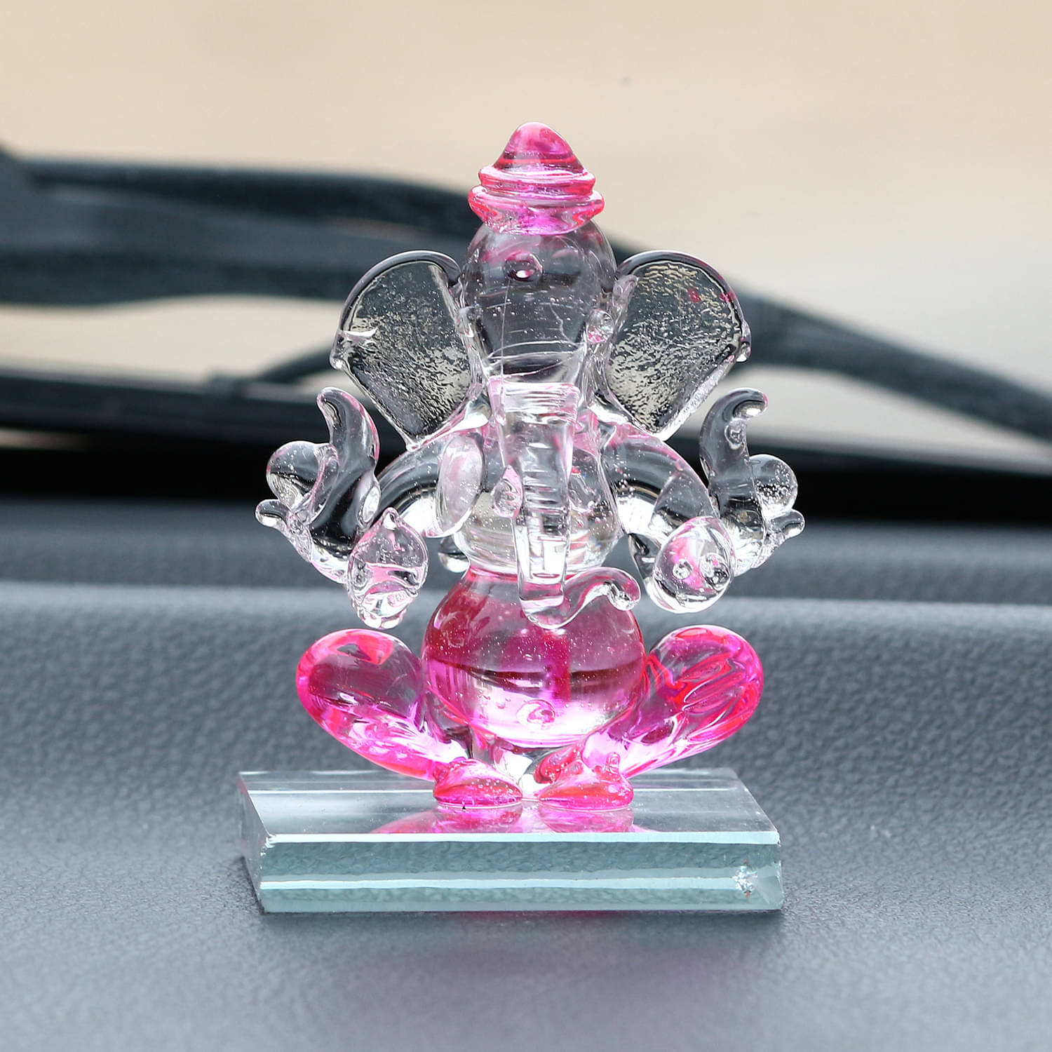 eCraftIndia Transparent & Pink Car Ganesha Showpieces eCraftIndia Transparent & Pink Car Ganesha Showpieces