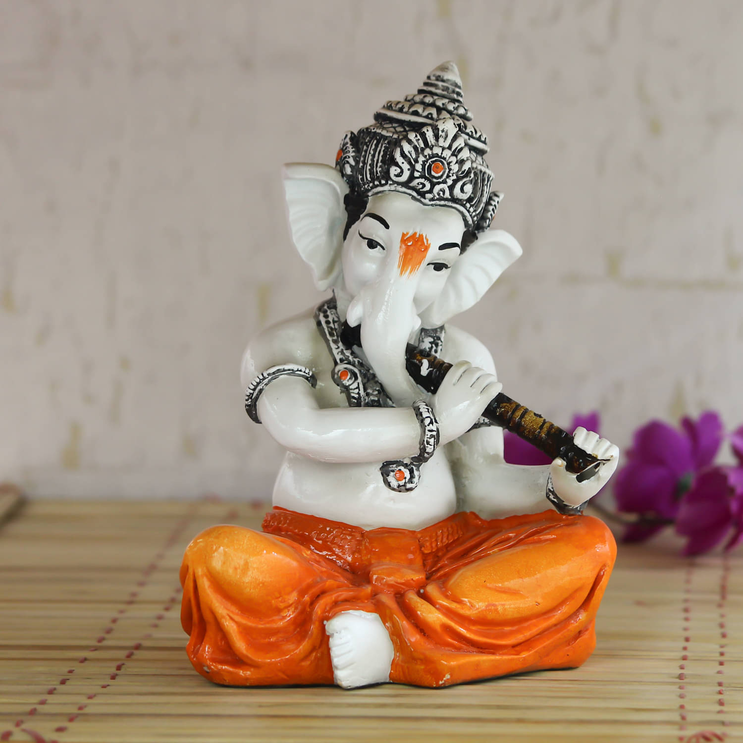     			eCraftIndia White & Orange Lord Ganesha Playing Flute Showpiece
