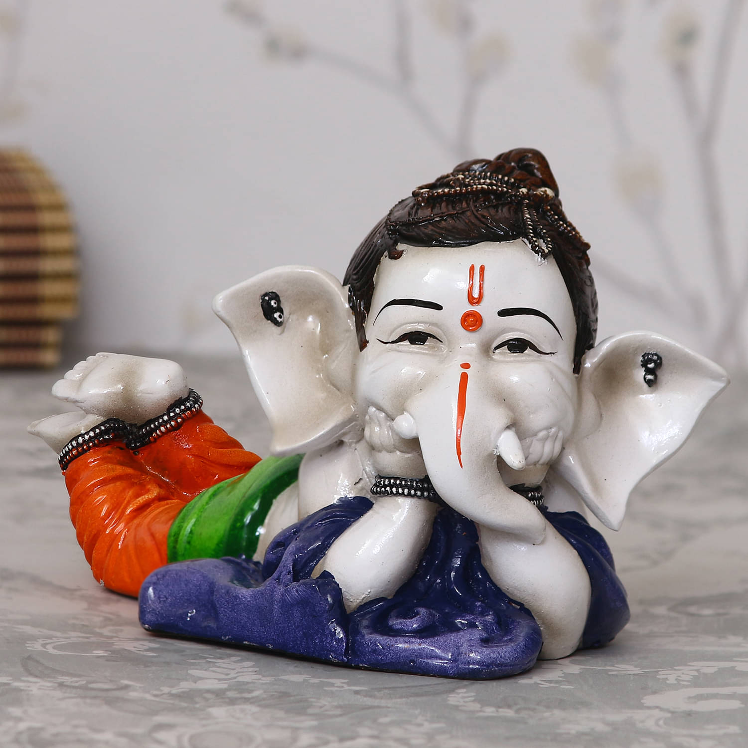 eCraftIndia Blue & White Decorative Lord Ganesha In Resting Position eCraftIndia Blue & White Decorative Lord Ganesha In Resting Position