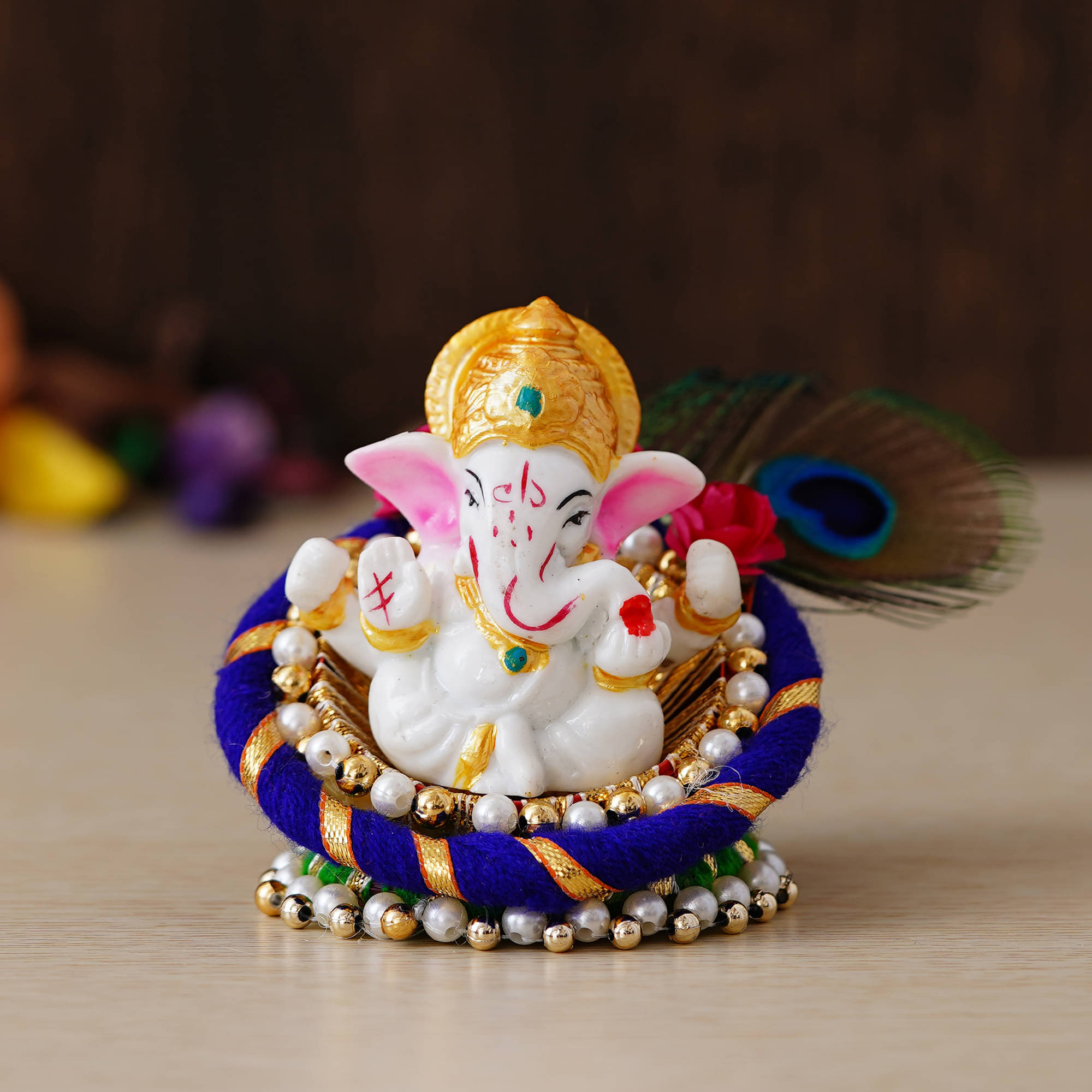     			eCraftIndia Blue & White Handcrafted Lord Ganesha Idol on Floral Plate with Peacock Feather Decorative Showpiece