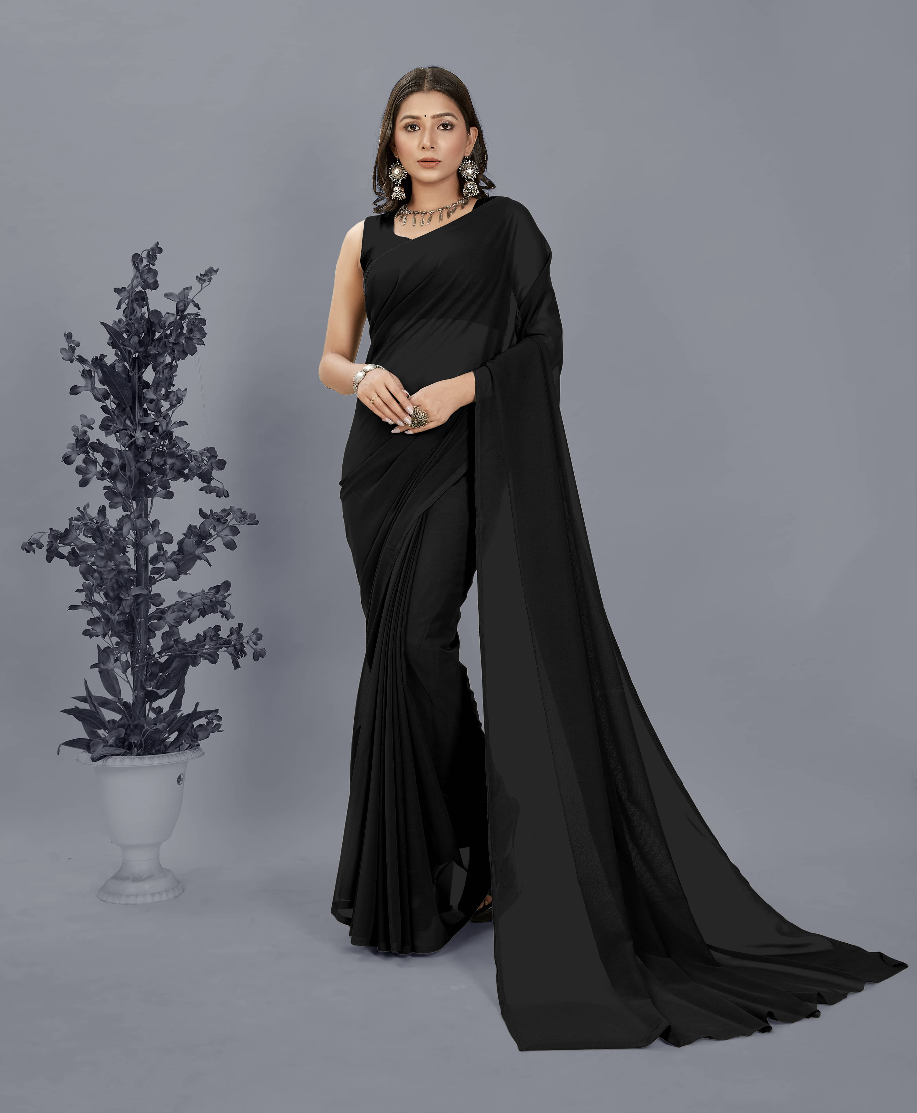 ANAND SAREES Georgette Solid Saree With Unstitched Blouse Piece ( Black ) ANAND SAREES Georgette Solid Saree With Unstitched Blouse Piece ( Black )