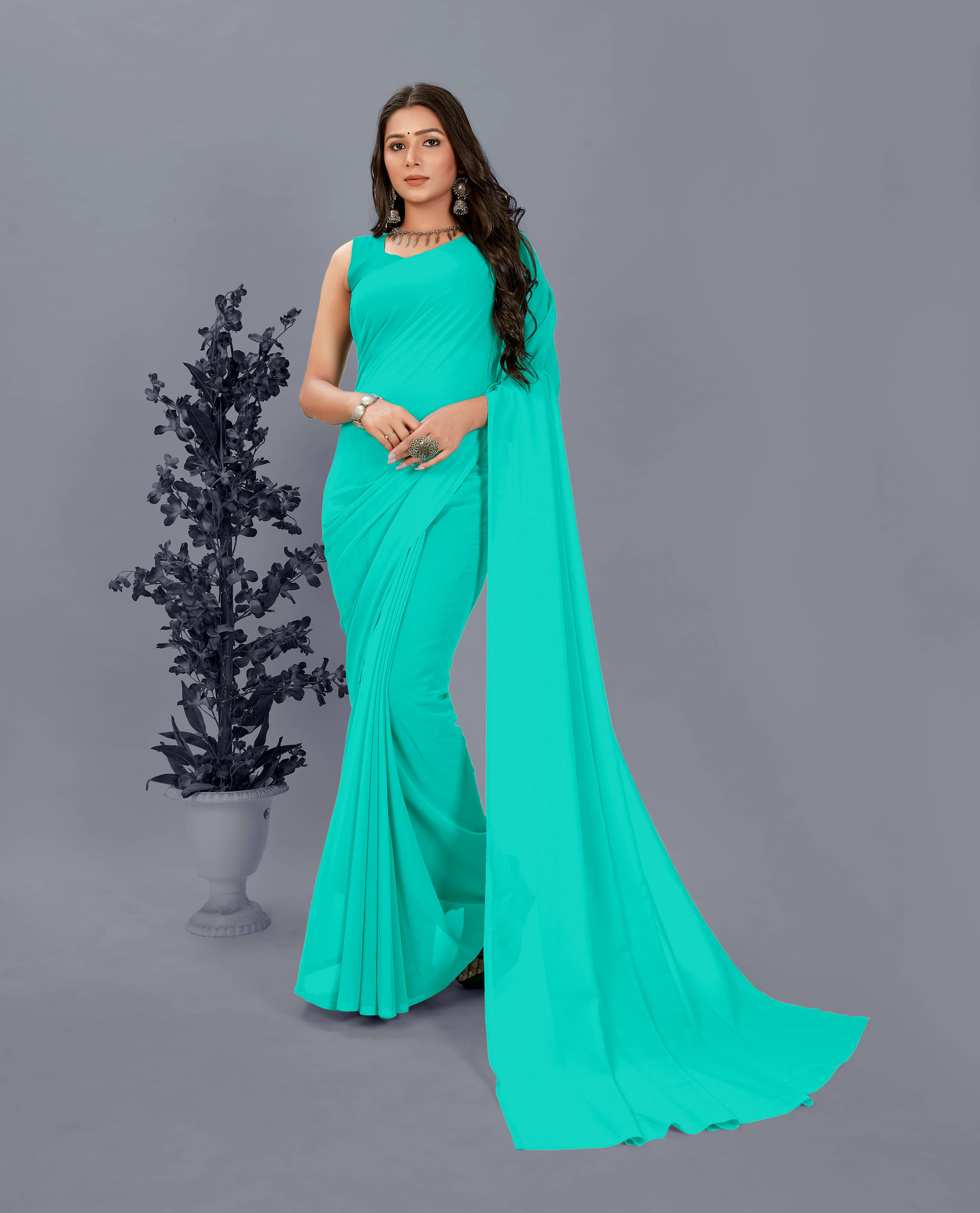 ANAND SAREES Georgette Solid Saree With Unstitched Blouse Piece ( Light Blue ) ANAND SAREES Georgette Solid Saree With Unstitched Blouse Piece ( Light Blue )