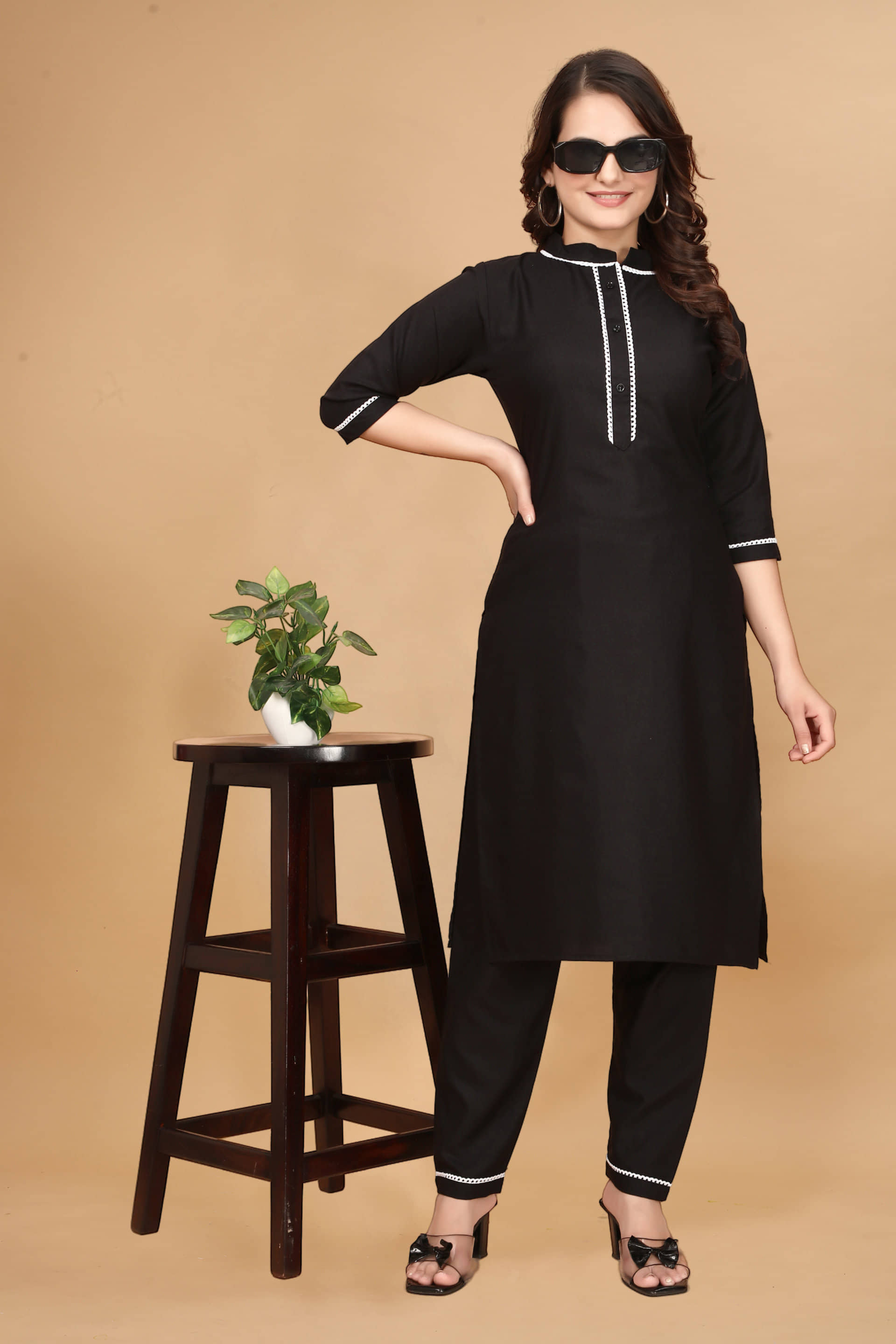 Nirja Fab Rayon Self Design Kurti With Pants Women's Stitched Salwar Suit - Black ( Pack of 1 )