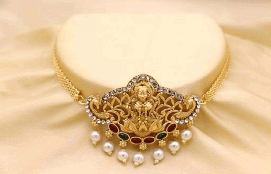     			RIENTA JWL Golden Alloy Necklace Set ( Pack of 1 )