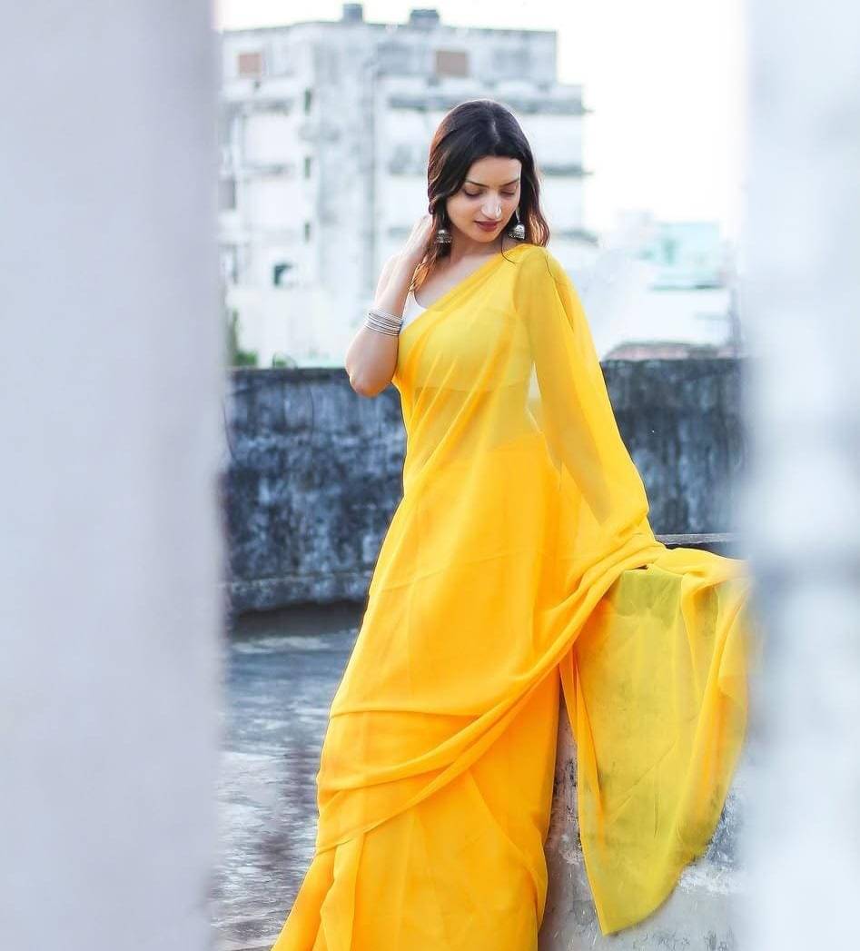 ANAND SAREES Georgette Solid Saree With Unstitched Blouse Piece ( Yellow ) ANAND SAREES Georgette Solid Saree With Unstitched Blouse Piece ( Yellow )