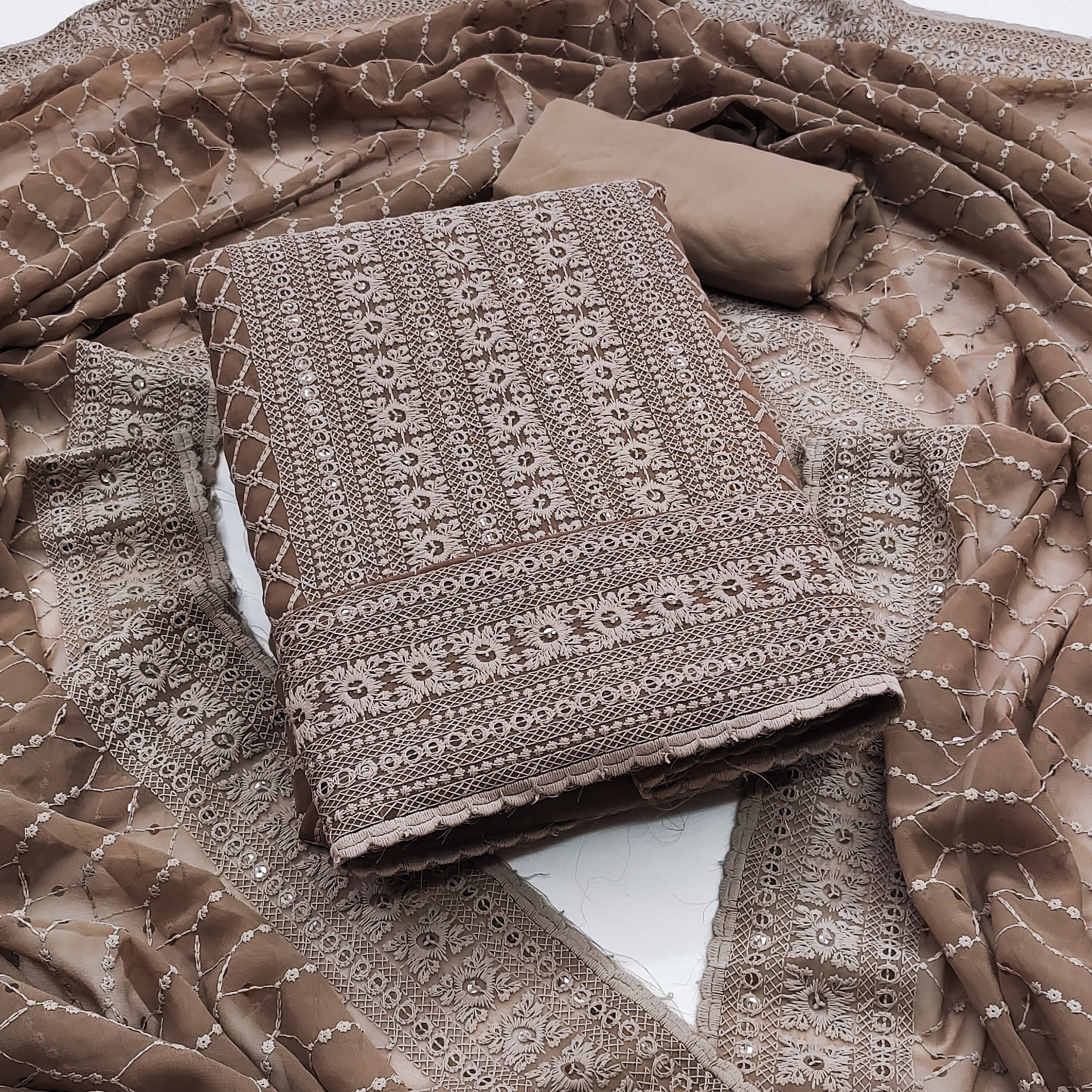 Nayanthara Trends Unstitched Georgette Embroidered Dress Material - Brown ( Pack of 1 ) Nayanthara Trends Unstitched Georgette Embroidered Dress Material - Brown ( Pack of 1 )