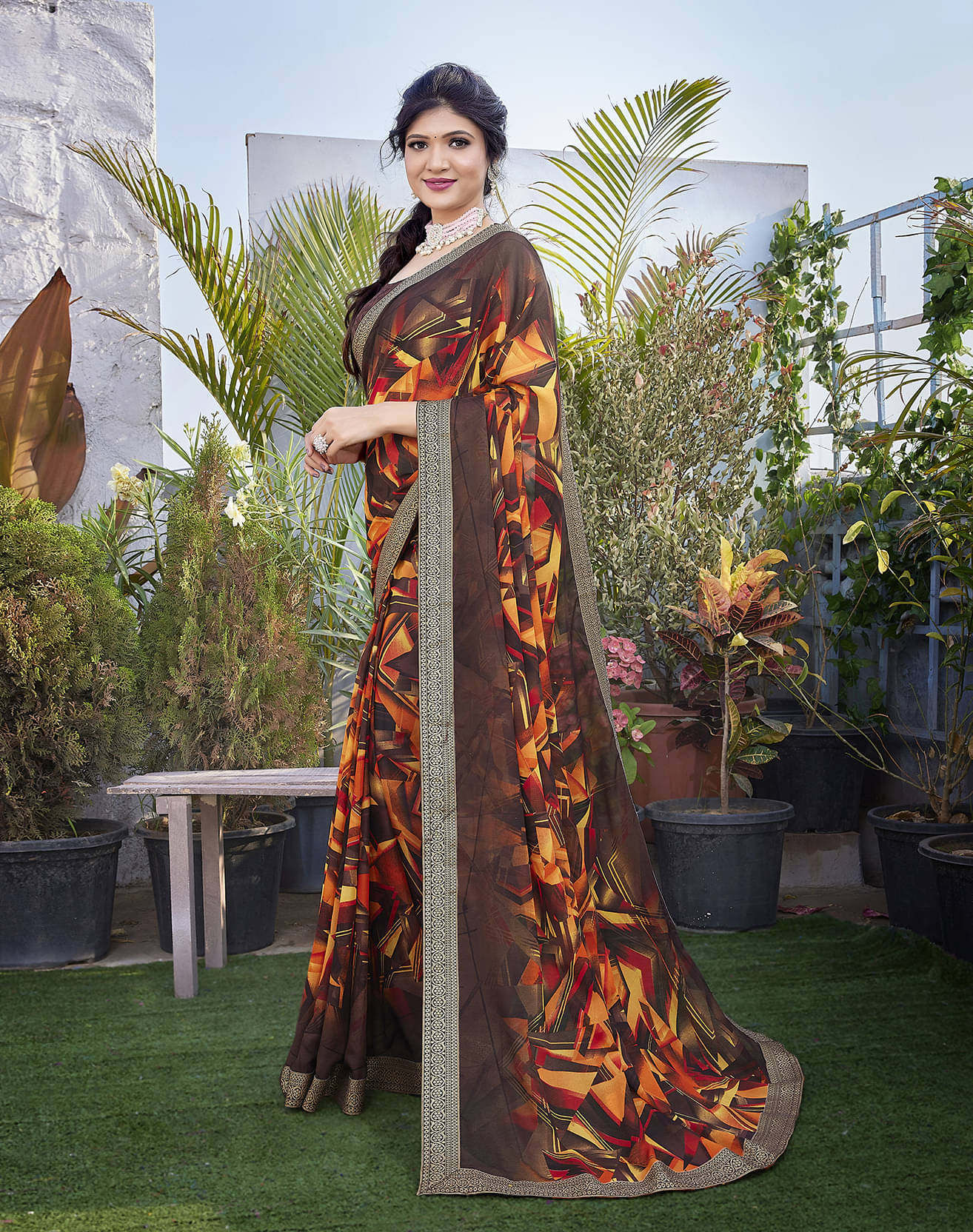     			Yashika Georgette Printed Saree With Unstitched Blouse Piece ( Brown )
