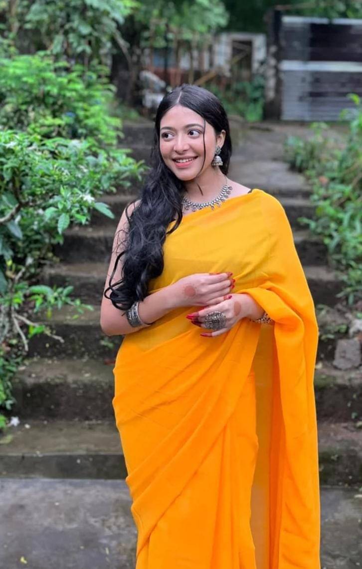 ANAND SAREES Georgette Solid Saree With Unstitched Blouse Piece ( Yellow ) ANAND SAREES Georgette Solid Saree With Unstitched Blouse Piece ( Yellow )