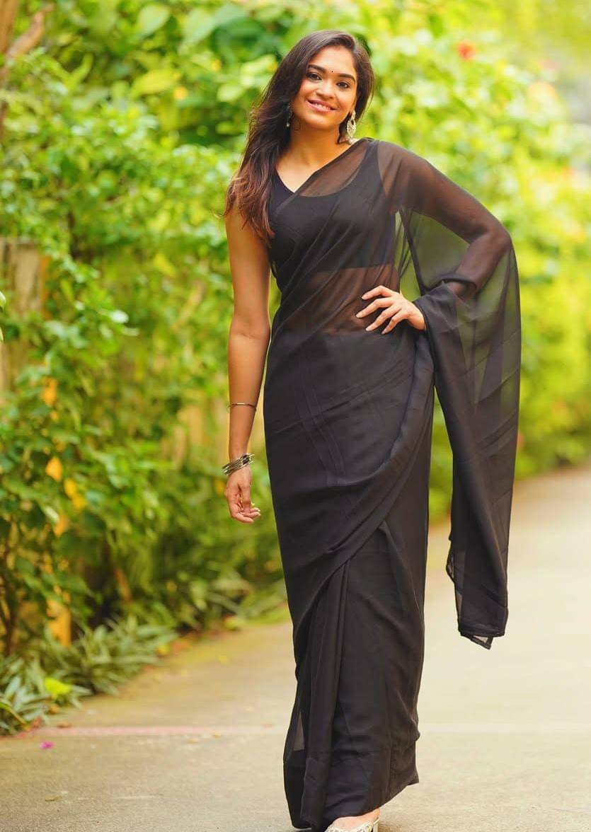 ANAND SAREES Georgette Solid Saree With Unstitched Blouse Piece ( Black ) ANAND SAREES Georgette Solid Saree With Unstitched Blouse Piece ( Black )