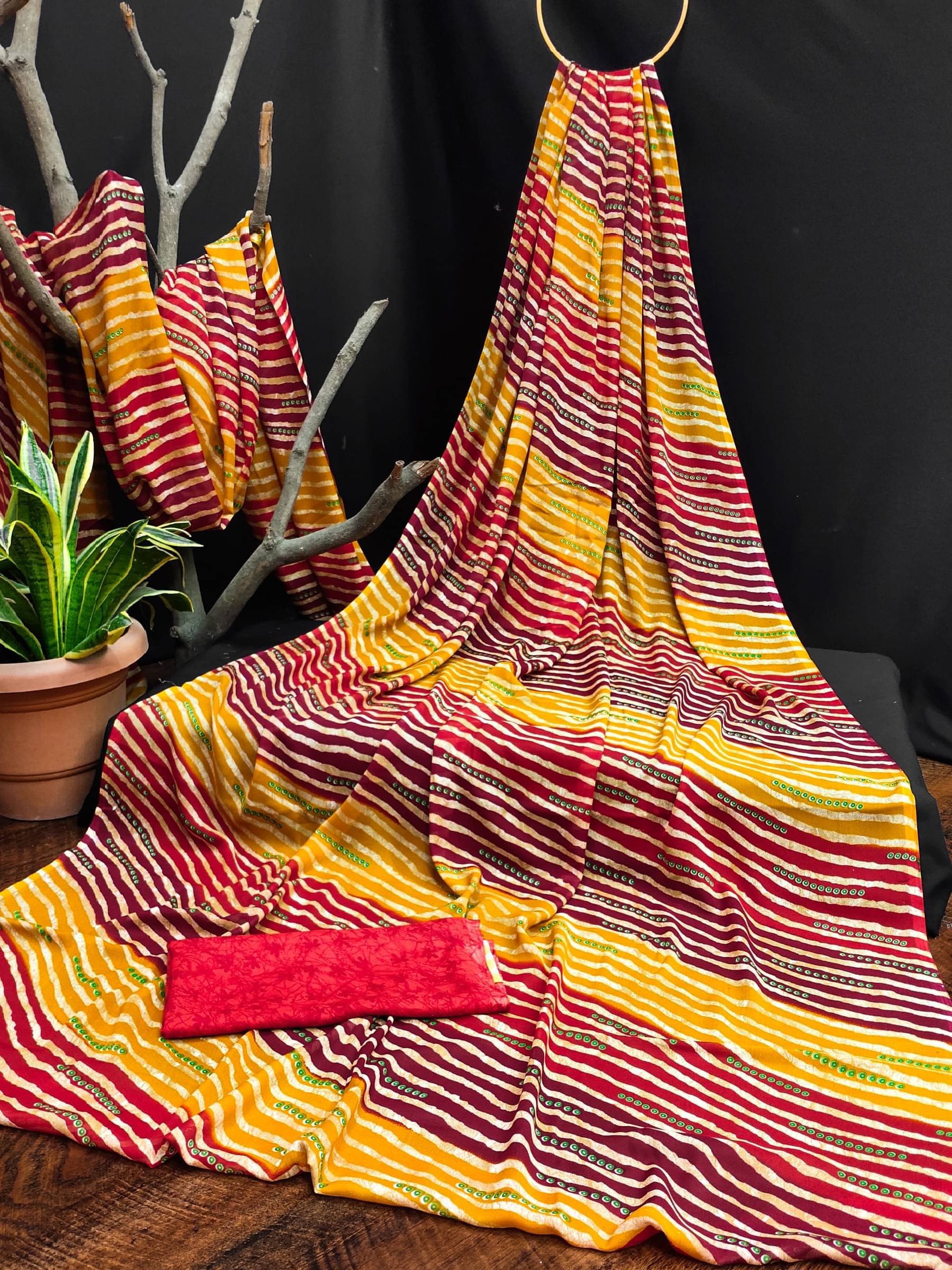 Kanooda Prints Georgette Printed Saree With Unstitched Blouse Piece ( Yellow )     			Kanooda Prints Georgette Printed Saree With Unstitched Blouse Piece ( Yellow )