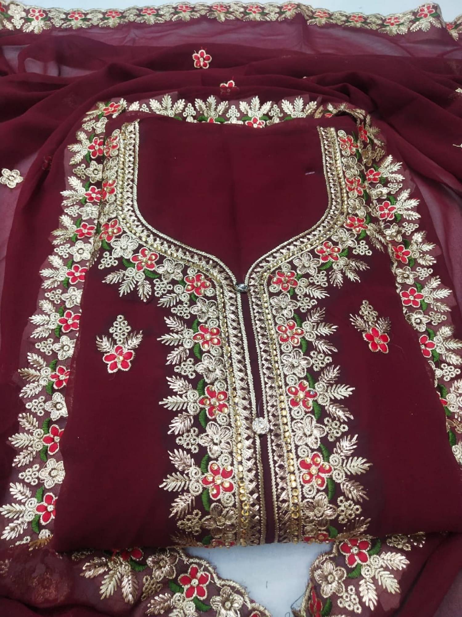     			Nayanthara Trends Unstitched Georgette Embroidered Dress Material - Maroon ( Pack of 1 )