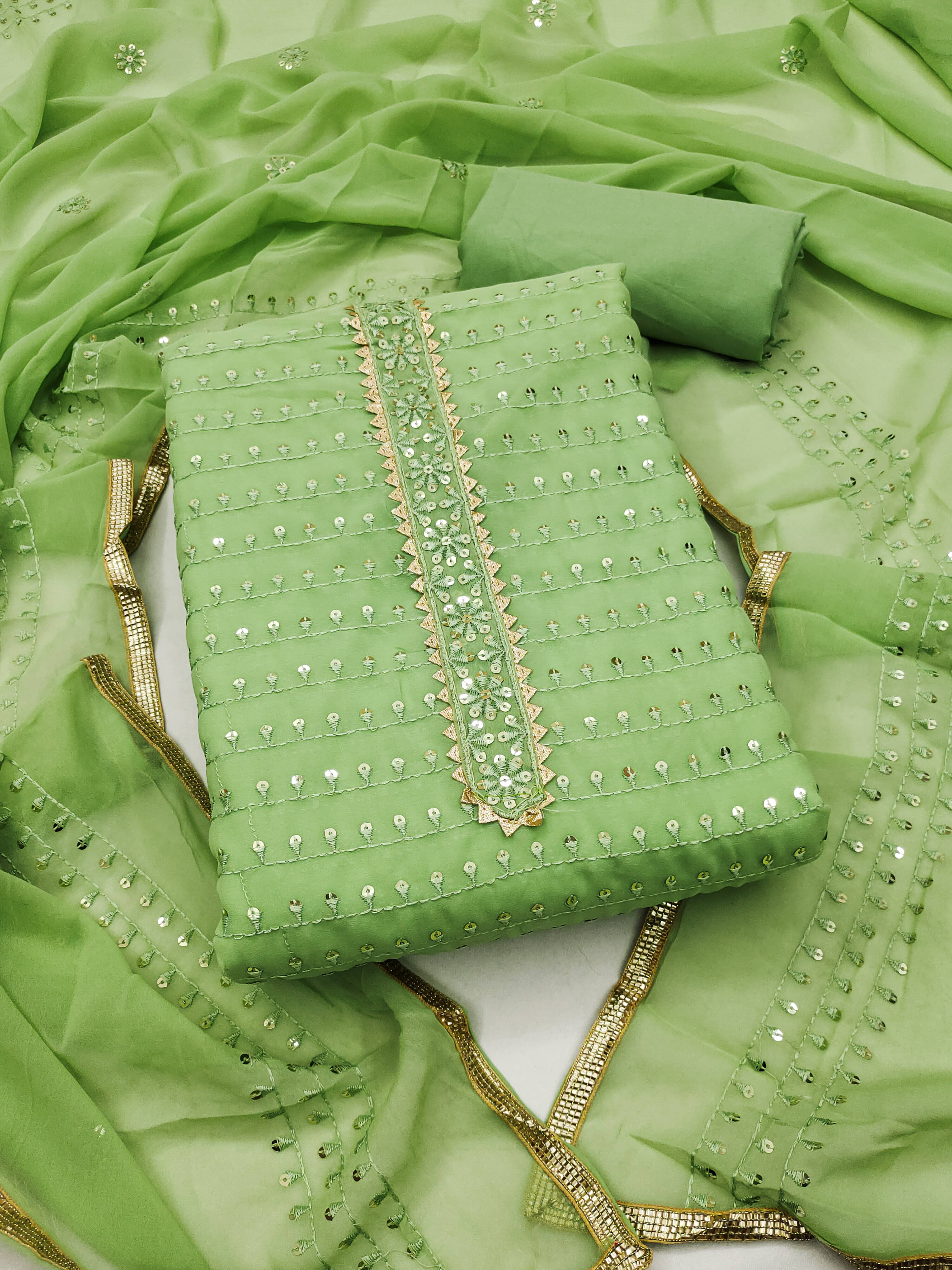 Nayanthara Trends Unstitched Georgette Embellished Dress Material - Green ( Pack of 1 ) Nayanthara Trends Unstitched Georgette Embellished Dress Material - Green ( Pack of 1 )