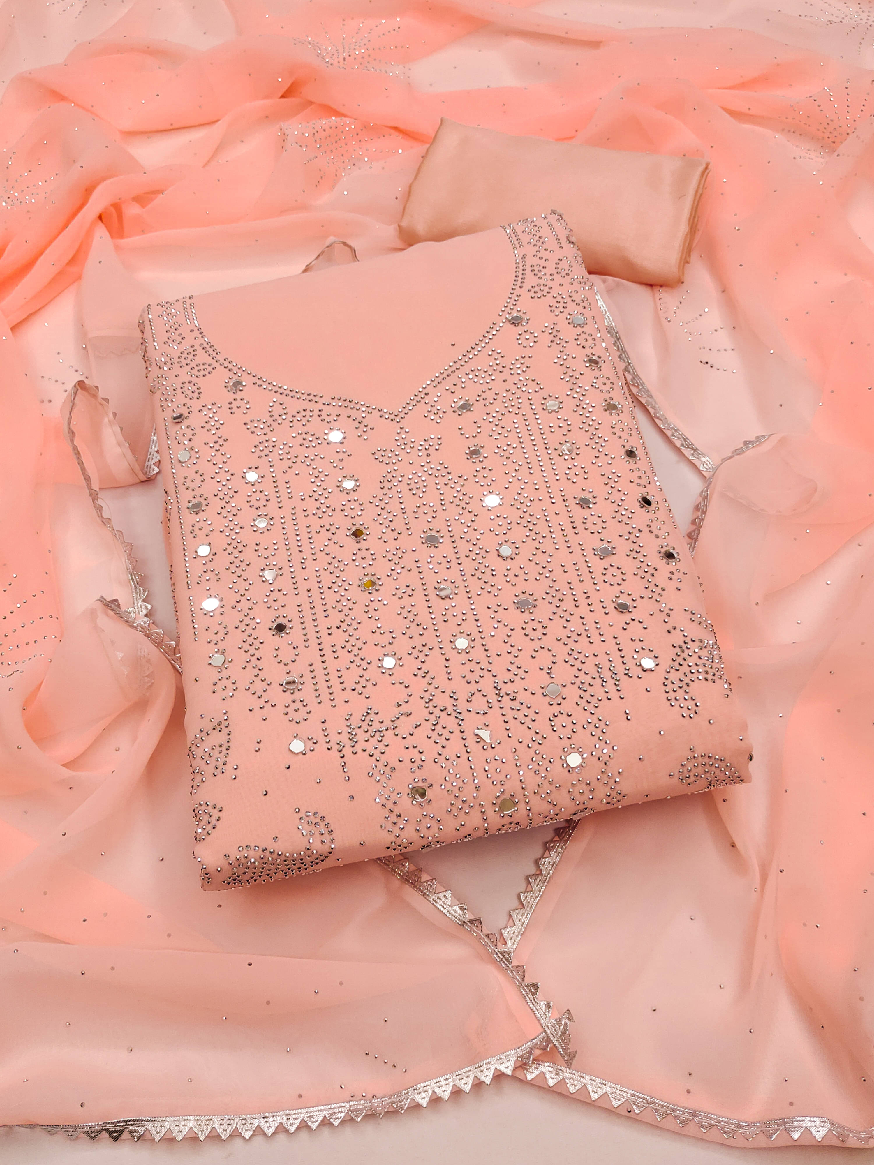 Nayanthara Trends Unstitched Georgette Embellished Dress Material - Peach ( Pack of 1 ) Nayanthara Trends Unstitched Georgette Embellished Dress Material - Peach ( Pack of 1 )