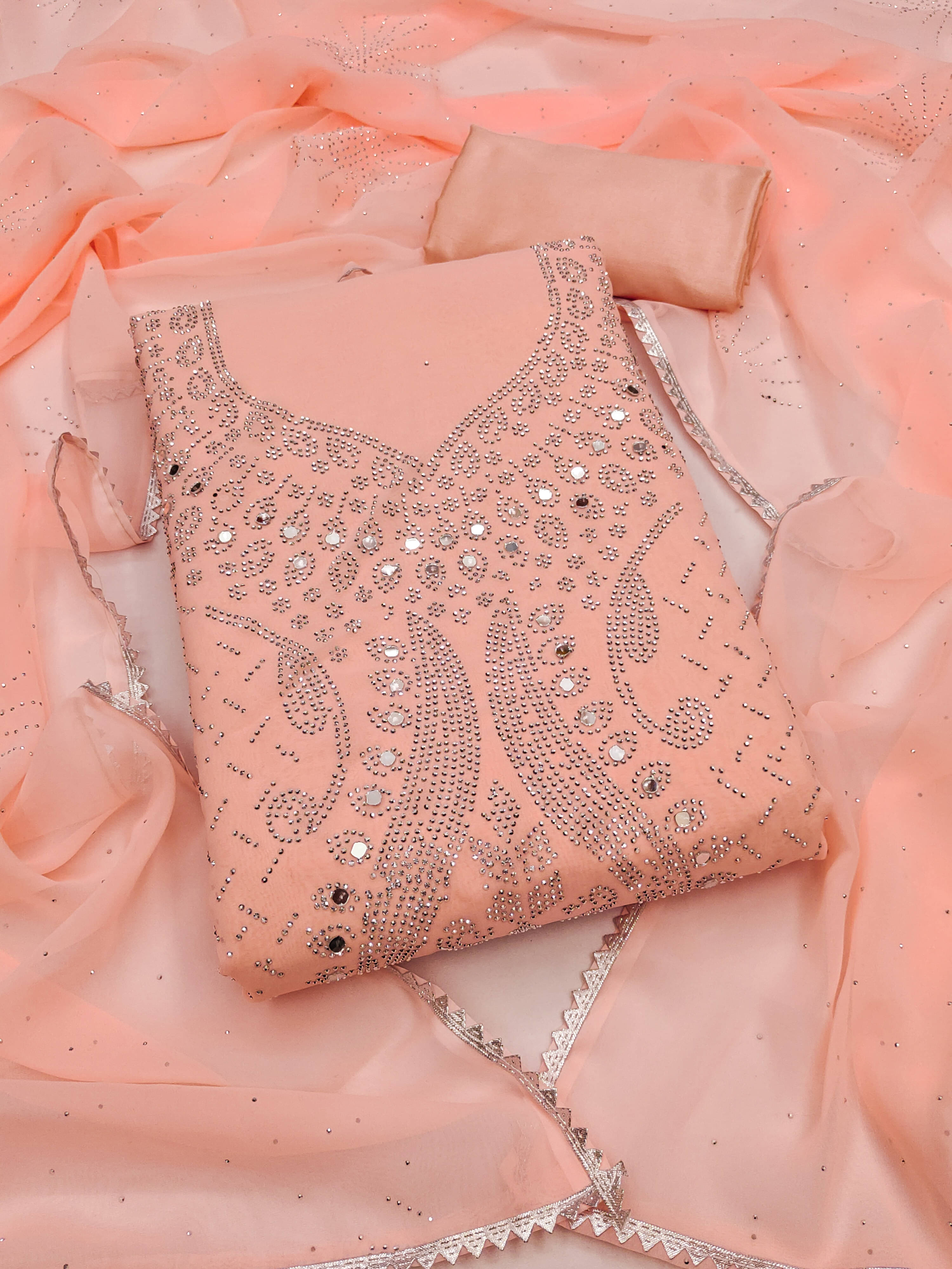 Nayanthara Trends Unstitched Georgette Embellished Dress Material - Peach ( Pack of 1 ) Nayanthara Trends Unstitched Georgette Embellished Dress Material - Peach ( Pack of 1 )