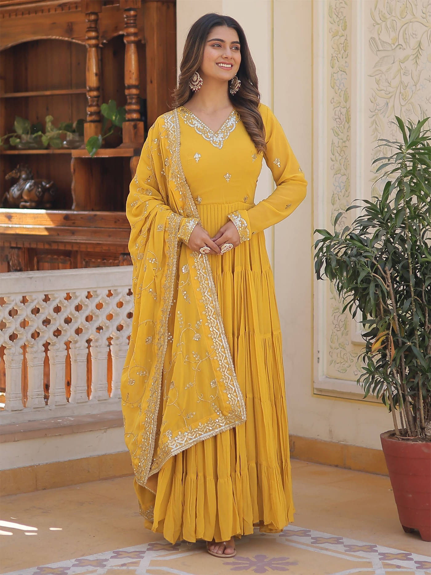 Trijal Fab Yellow Anarkali Georgette Women's Stitched Ethnic Gown ( Pack of 1 )     			Trijal Fab Yellow Anarkali Georgette Women's Stitched Ethnic Gown ( Pack of 1 )
