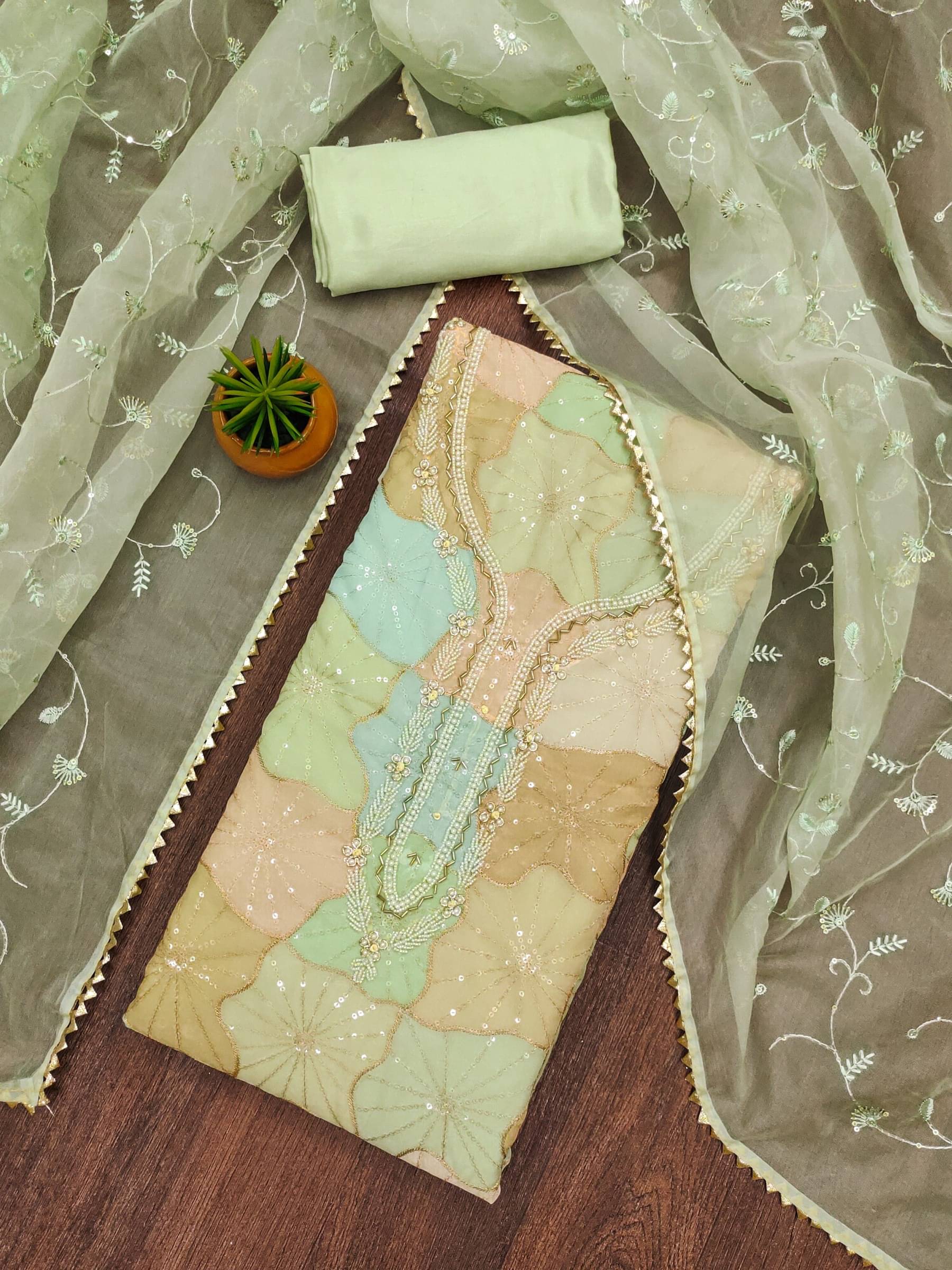 Rangtulika Ethnics Unstitched Organza Embroidered Dress Material - Teal ( Pack of 1 )     			Rangtulika Ethnics Unstitched Organza Embroidered Dress Material - Teal ( Pack of 1 )