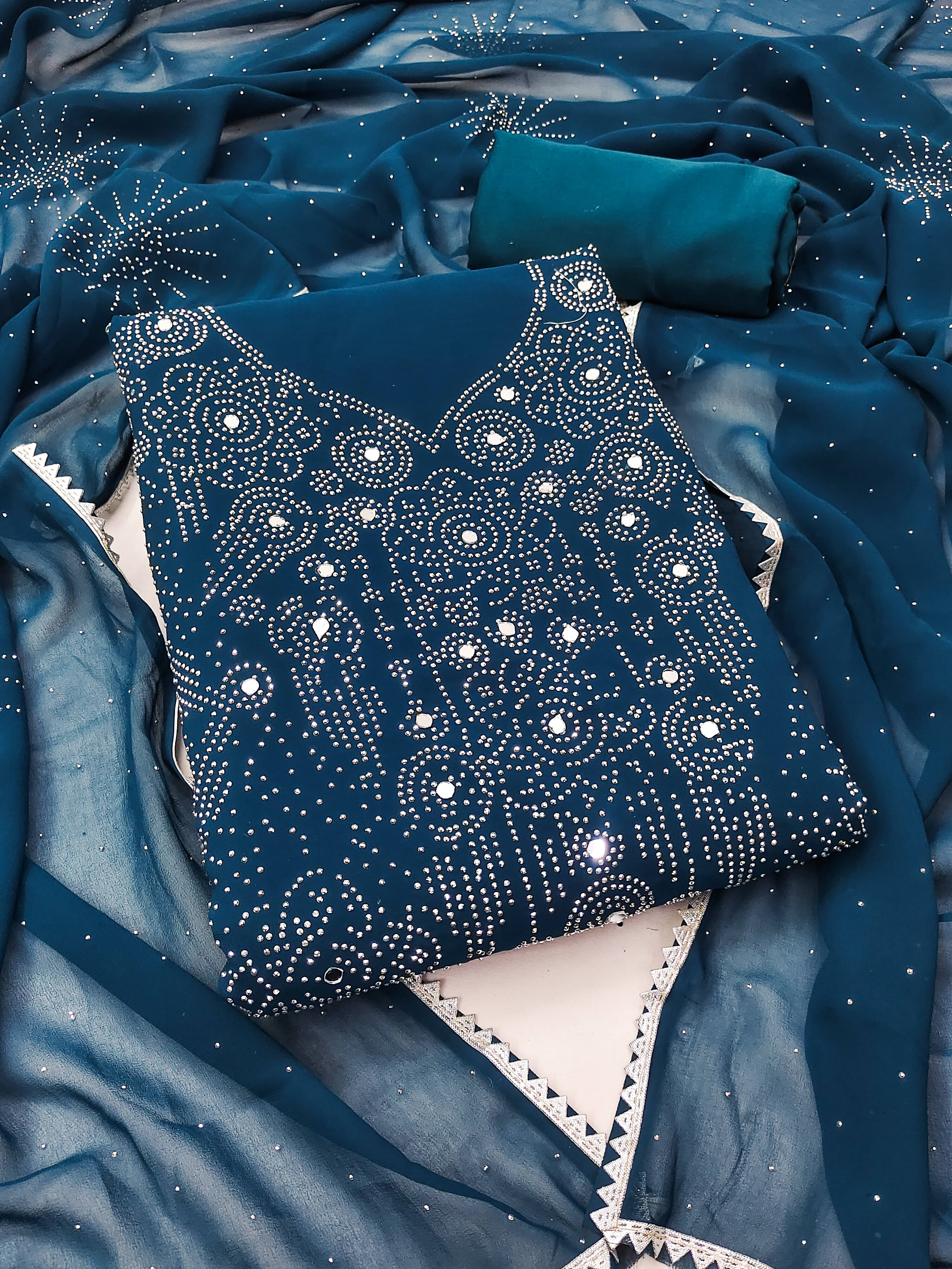 Nayanthara Trends Unstitched Georgette Embellished Dress Material - Blue ( Pack of 1 ) Nayanthara Trends Unstitched Georgette Embellished Dress Material - Blue ( Pack of 1 )