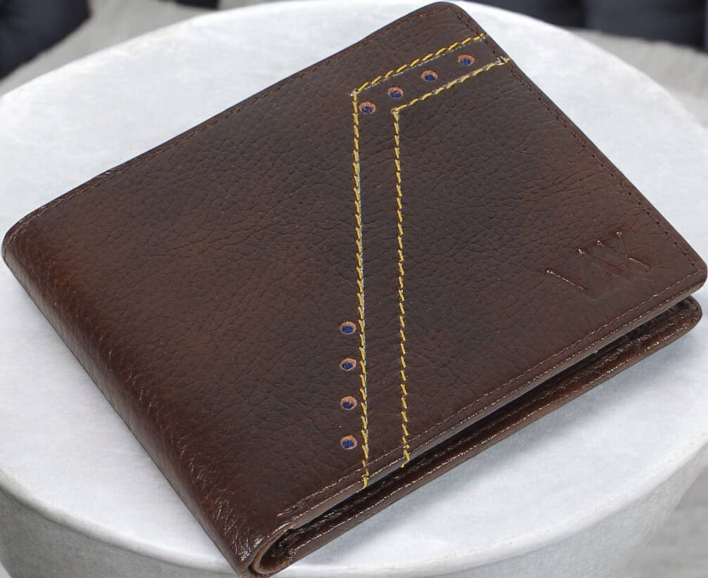 WILDAUK 100% Leather Self Design Men's Regular Wallet With More Than 10 Slots For Card ( Brown , Pack of 1 )     			WILDAUK 100% Leather Self Design Men's Regular Wallet With More Than 10 Slots For Card ( Brown , Pack of 1 )