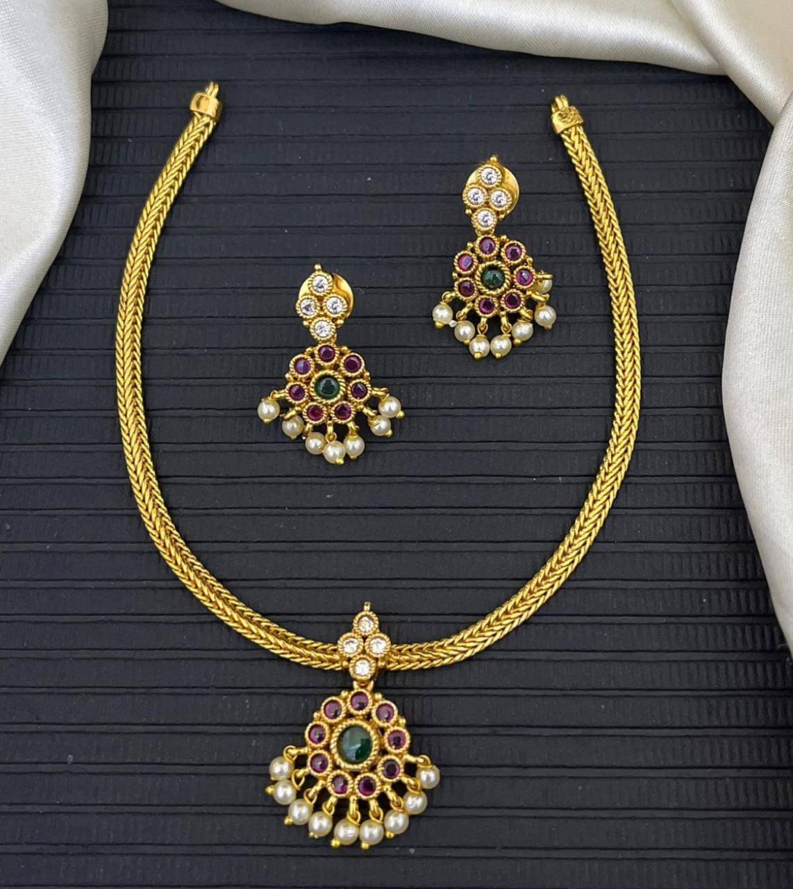     			KC JEWELS Multi Color Brass Necklace Set ( Pack of 1 )