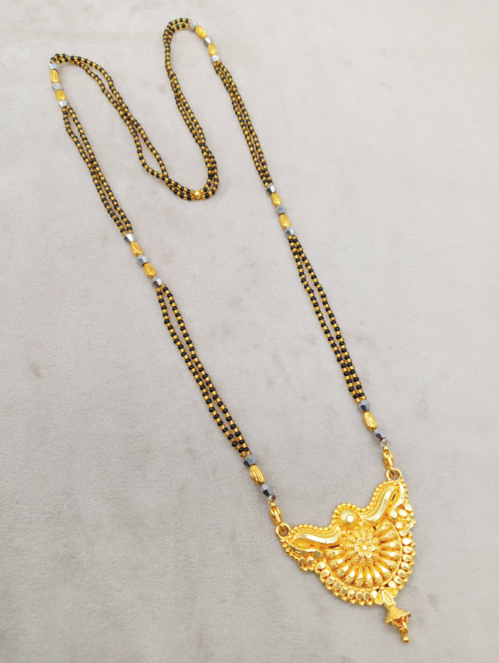 SHANKHRAJ MA LL Golden Mangalsutra ( Pack of 1 )     			SHANKHRAJ MA LL Golden Mangalsutra ( Pack of 1 )