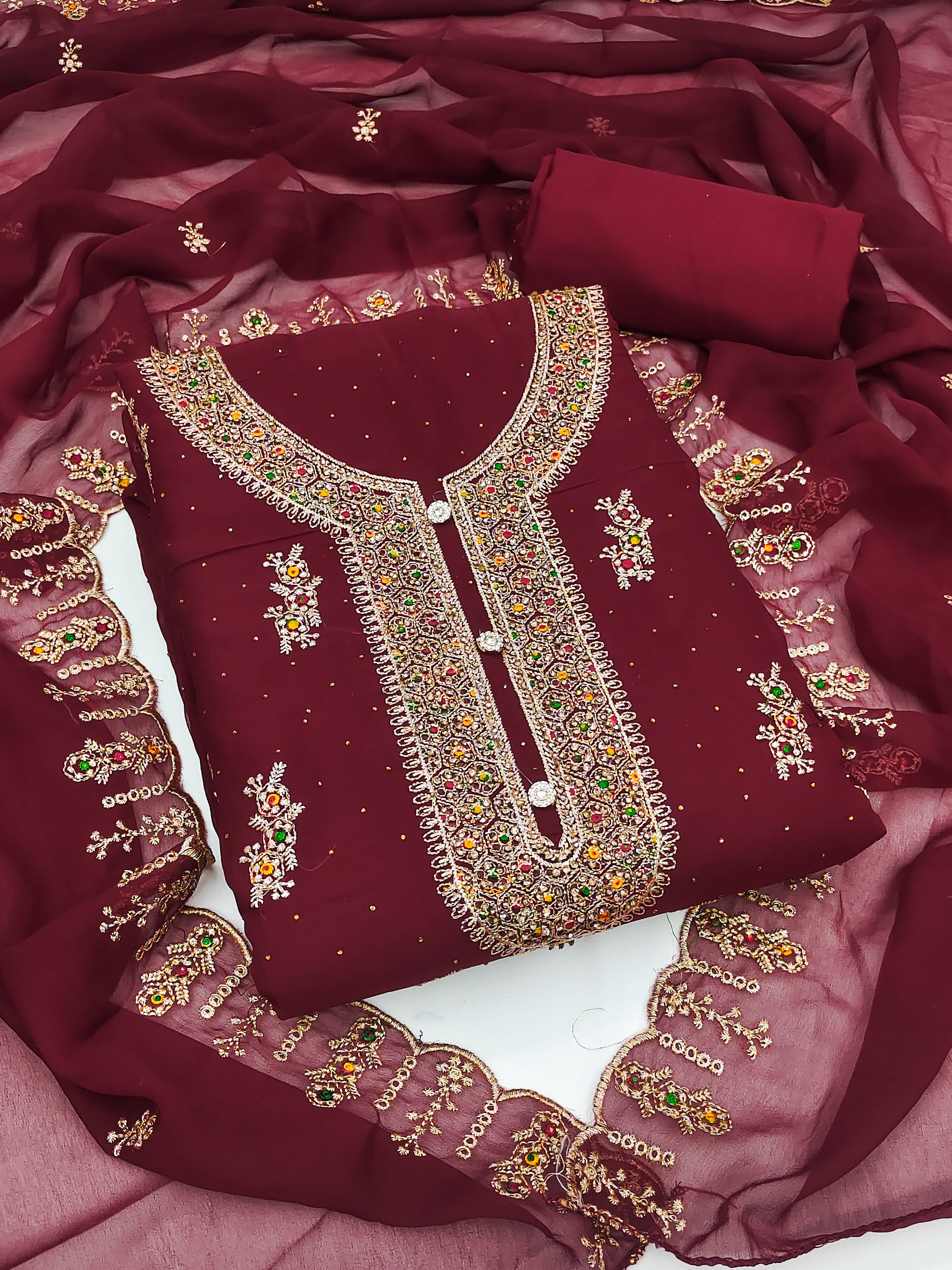 Nayanthara Trends Women Georgette Unstitched Dress Material ( Maroon )     			Nayanthara Trends Women Georgette Unstitched Dress Material ( Maroon )