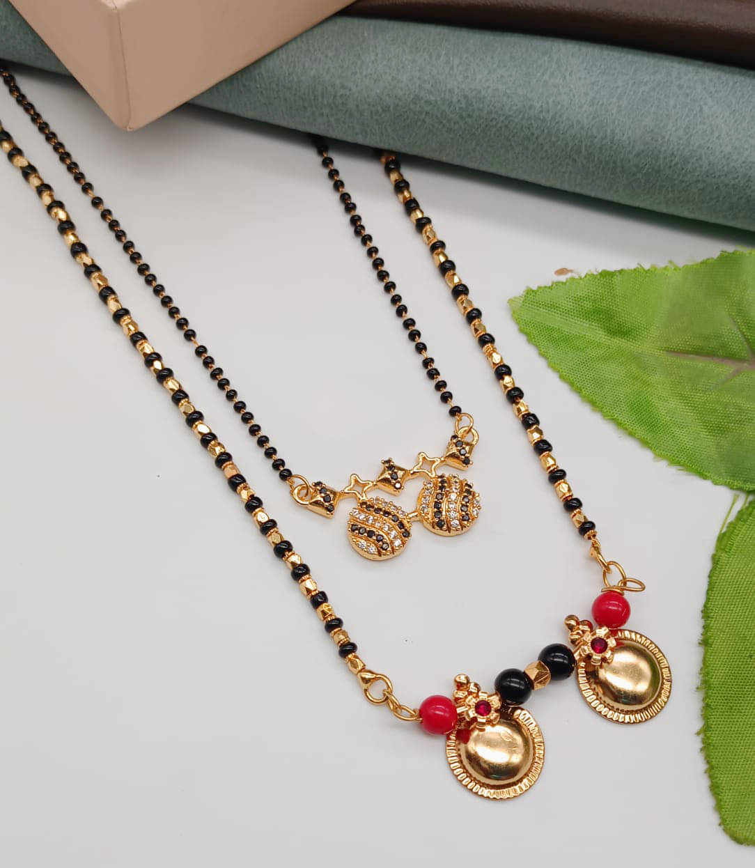 SHANKHRAJ MA LL Golden Mangalsutra ( Pack of 2 )     			SHANKHRAJ MA LL Golden Mangalsutra ( Pack of 2 )