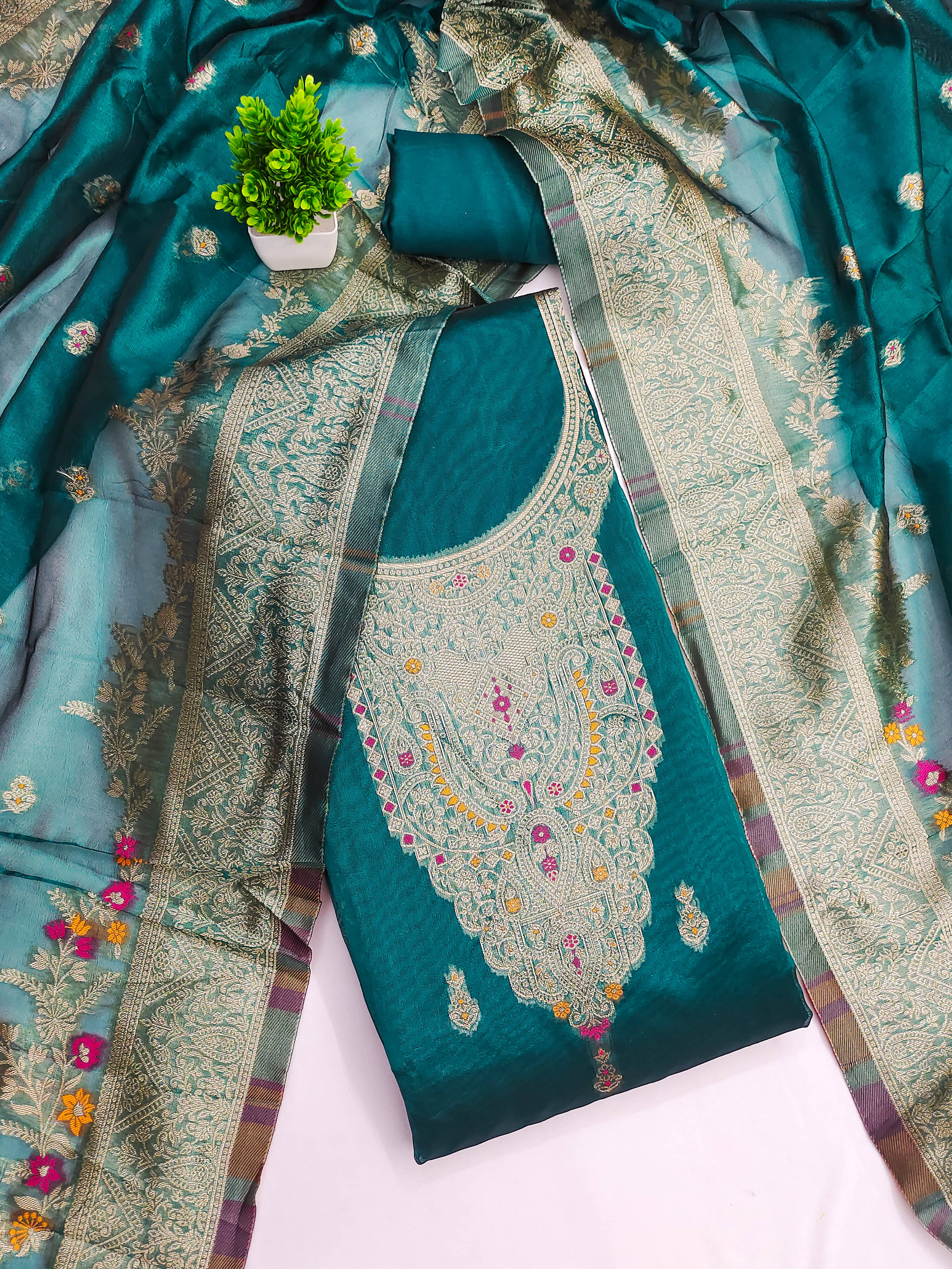     			Nayanthara Trends Women Jacquard Unstitched Dress Material ( Teal )