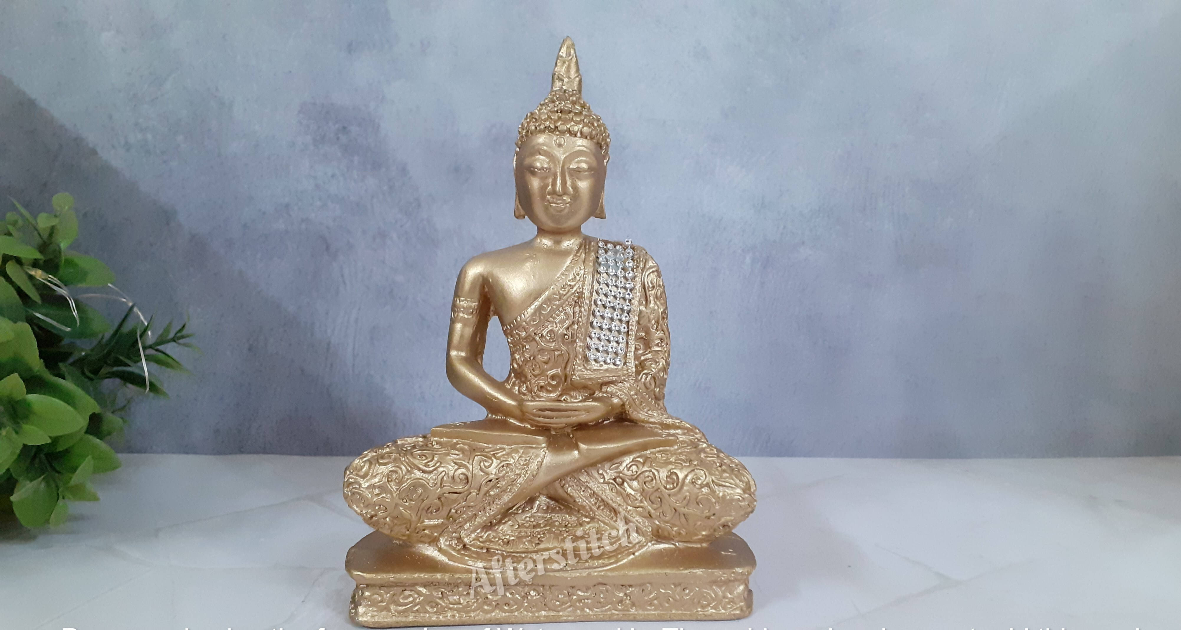 AFTERSTITCH Golden Meditating Lord Gautam Buddha Idol Statue for Home Office Living Room Table Decor,Gift showpieces     			AFTERSTITCH Golden Meditating Lord Gautam Buddha Idol Statue for Home Office Living Room Table Decor,Gift showpieces