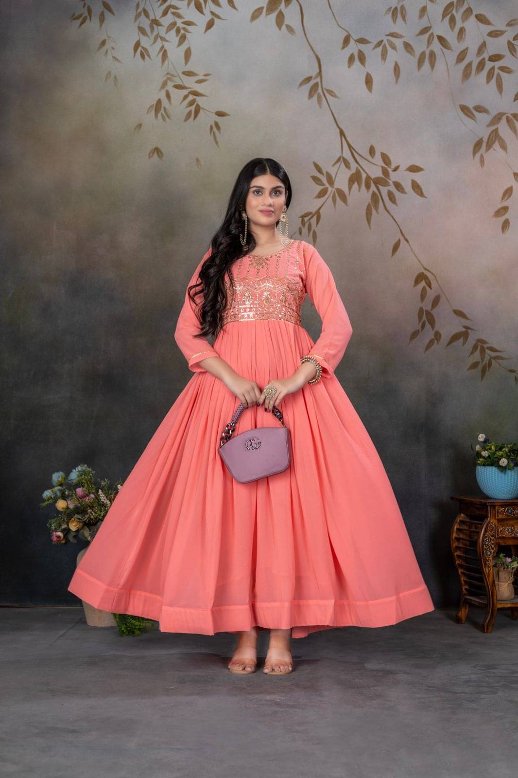 keshav fashion Women Georgette Flared Stitched Ethnic Gown ( Peach ) keshav fashion Women Georgette Flared Stitched Ethnic Gown ( Peach )