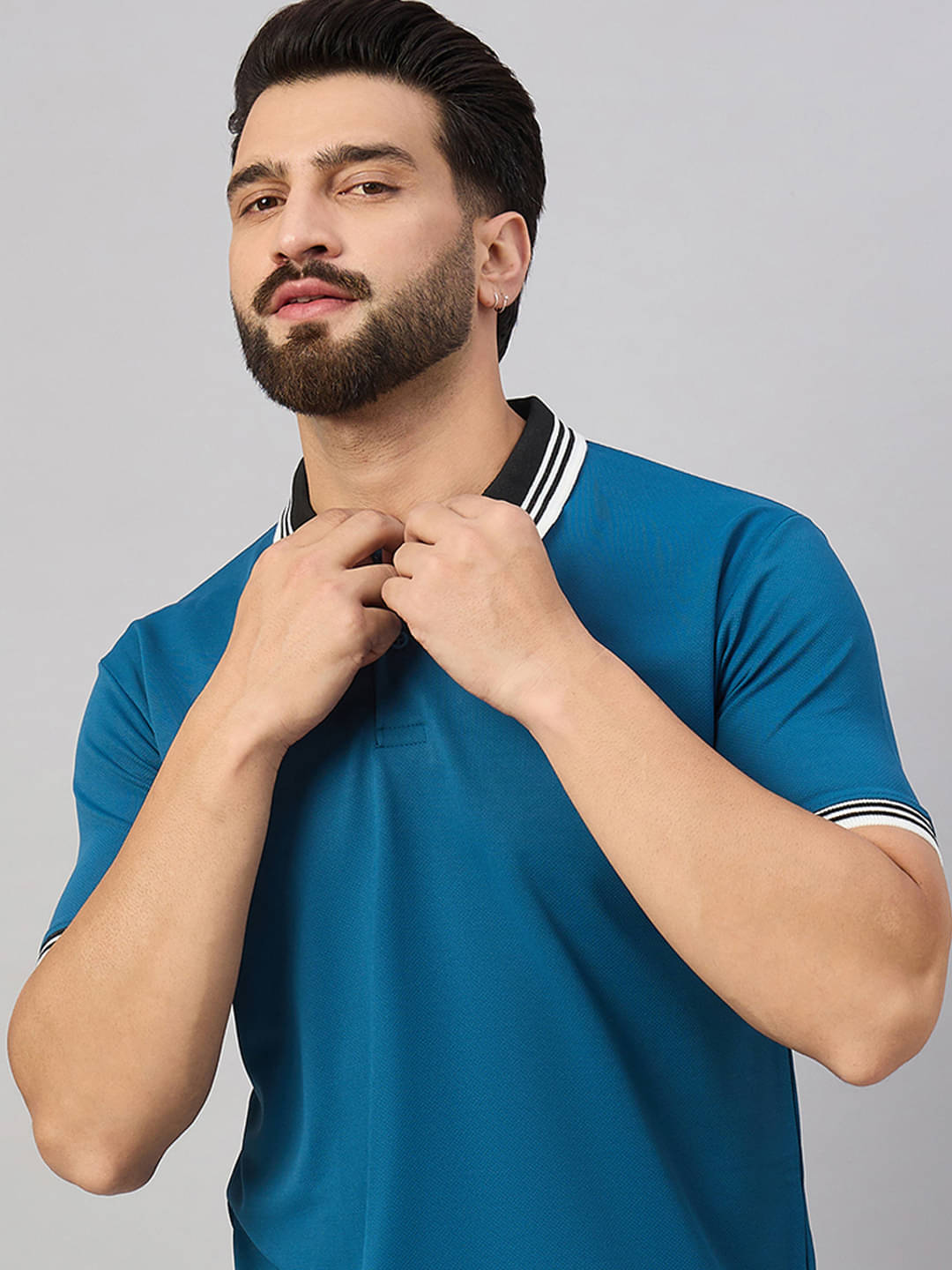 Merriment Men Cotton Blend Regular Fit Solid Polo T Shirt ( Teal Blue ) Merriment Men Cotton Blend Regular Fit Solid Polo T Shirt ( Teal Blue )