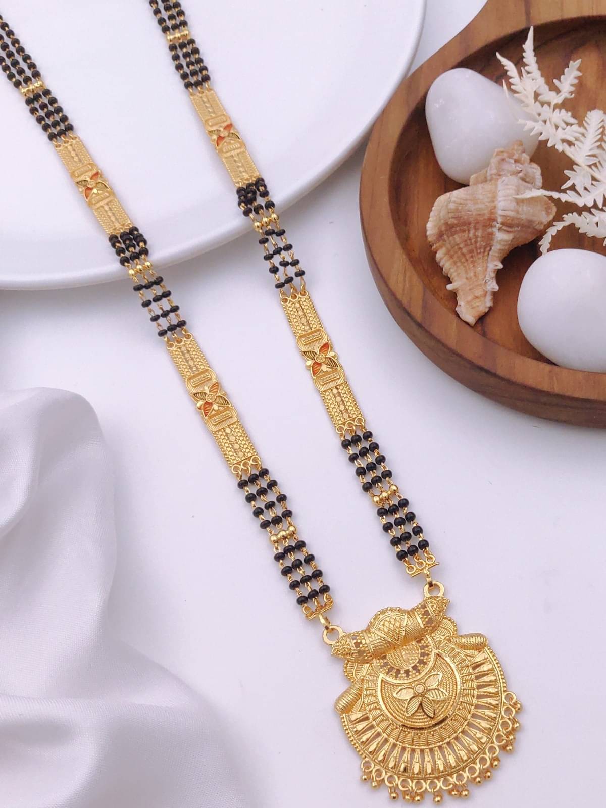 TKRB SALES Golden Mangalsutra ( Pack of 1 )     			TKRB SALES Golden Mangalsutra ( Pack of 1 )