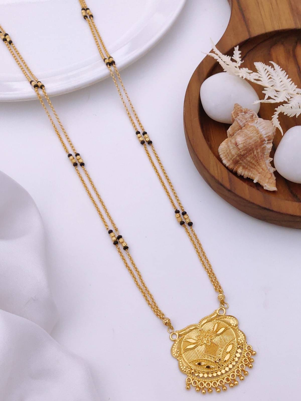 TKRB SALES Golden Mangalsutra ( Pack of 1 )     			TKRB SALES Golden Mangalsutra ( Pack of 1 )