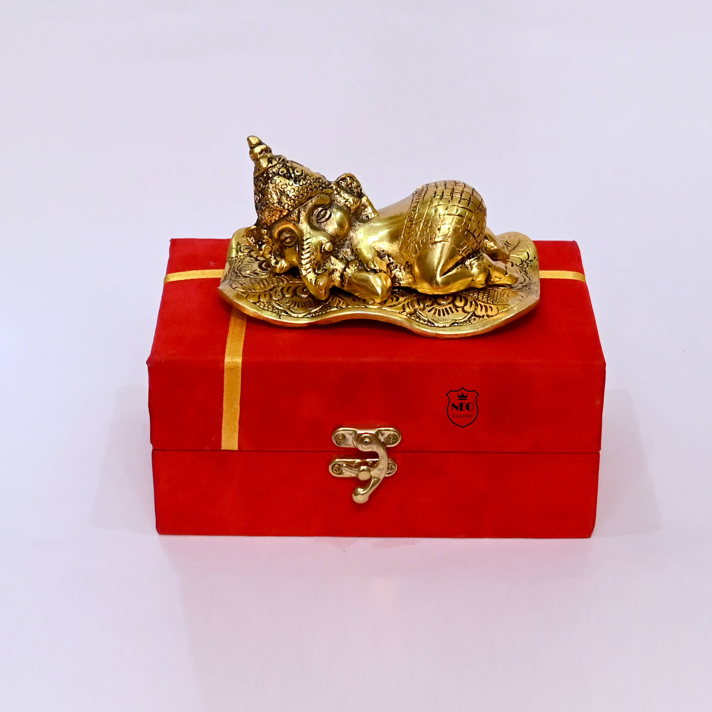 Neo Classic Ganesh Sleeping Metal Statues I Gold Plated Baby Ganesh With Red Valvate Box Decorative Showpiece - 8 cm (Aluminium, Gold, Red) Neo Classic Ganesh Sleeping Metal Statues I Gold Plated Baby Ganesh With Red Valvate Box Decorative Showpiece - 8 cm (Aluminium, Gold, Red)