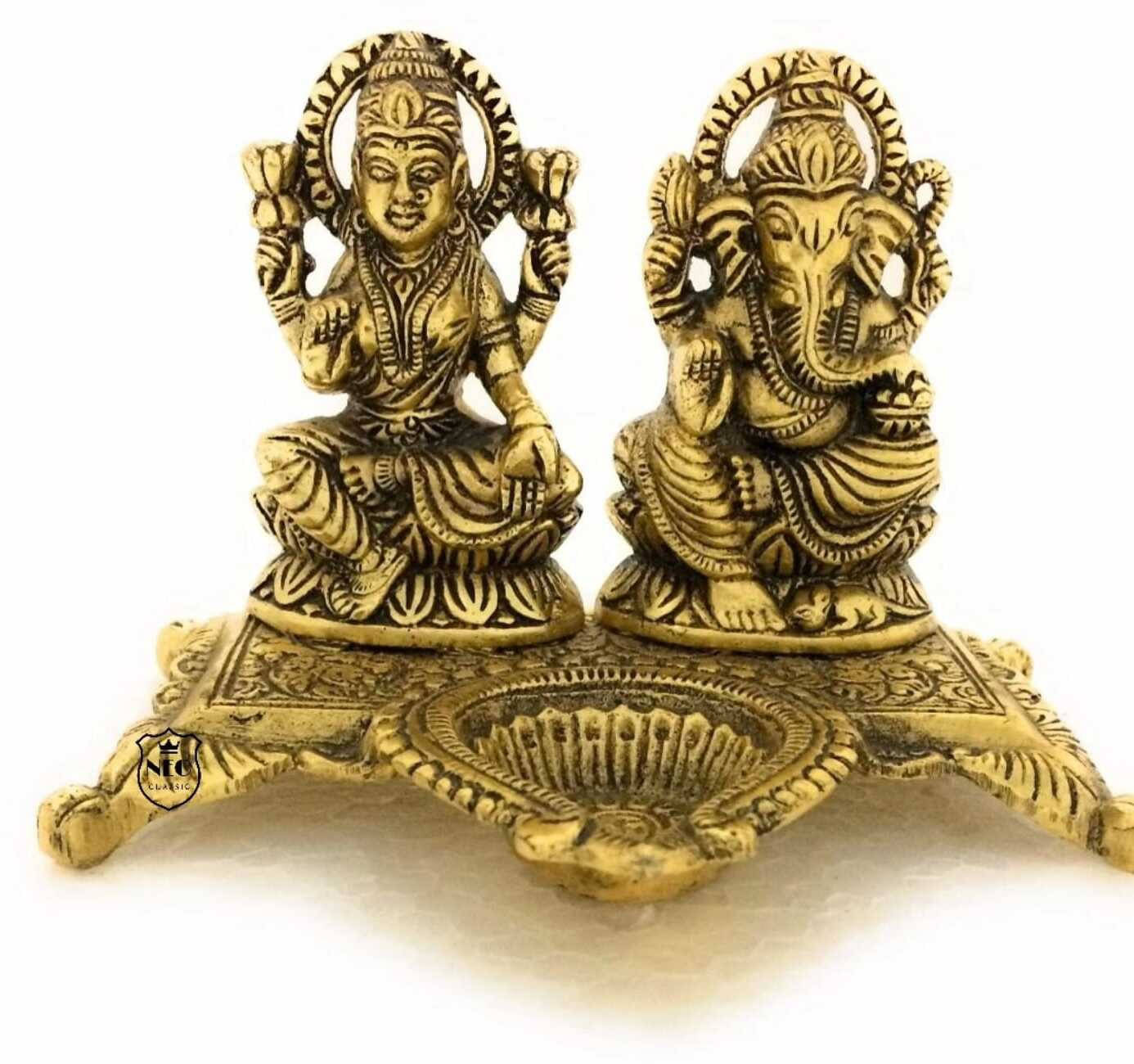     			Neo Classic Laxmi Ganesh Idol Showpiece Oil Lamp Diya Deepak - Metal Lakshmi Ganesh Statue Decorative Showpiece  -  10 cm (Aluminium, Gold)