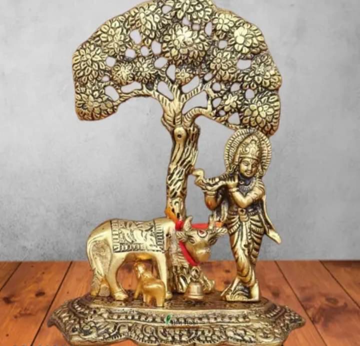     			Metal Krishna with standing tree under cow