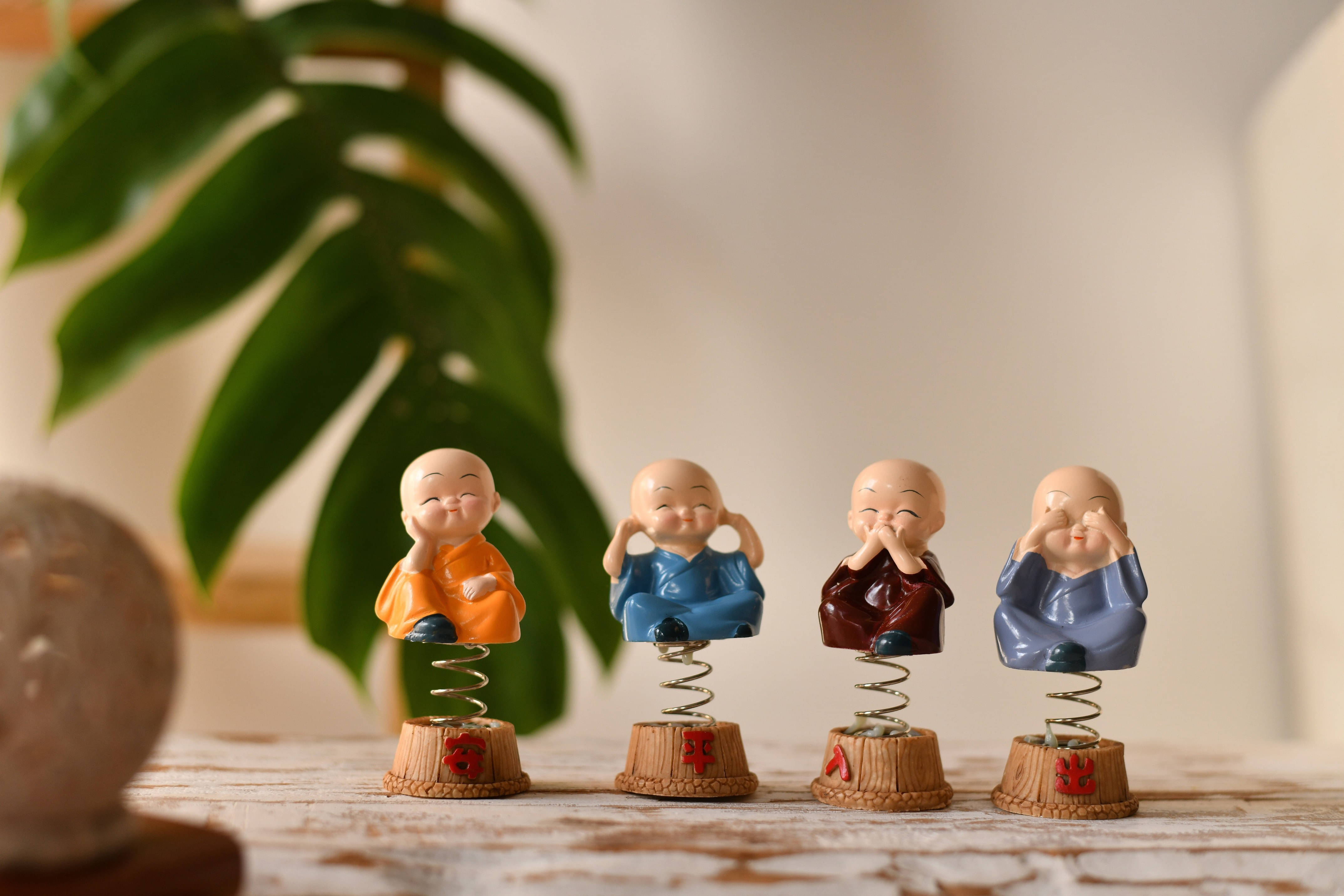 Fashion Bizz Spring Monks Buddha Decorative Showpiece - 9 cm, Pack of 4 Fashion Bizz Spring Monks Buddha Decorative Showpiece - 9 cm, Pack of 4