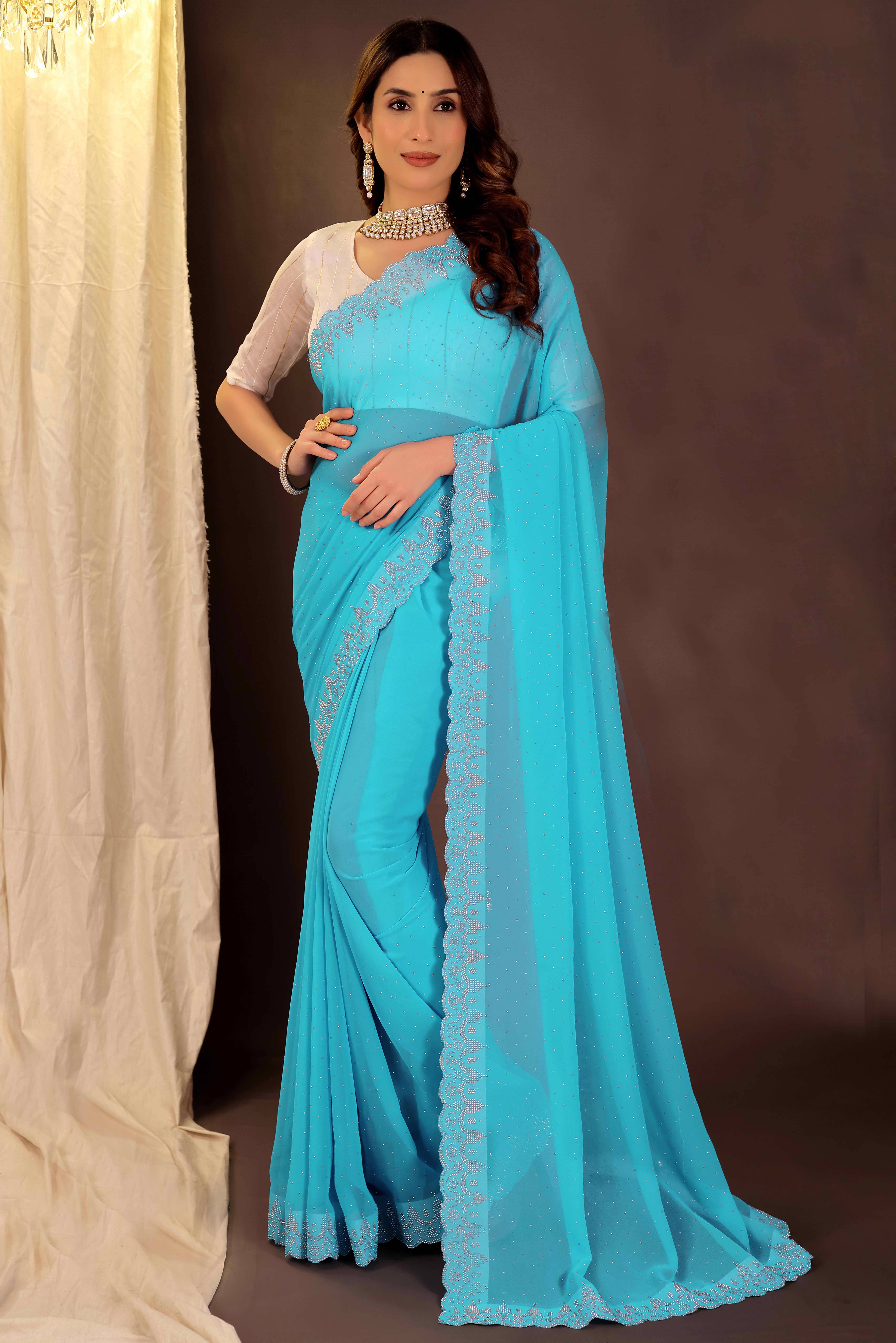 Suali Georgette Embellished Saree With Unstitched Blouse Piece ( Sky Blue ) Suali Georgette Embellished Saree With Unstitched Blouse Piece ( Sky Blue )