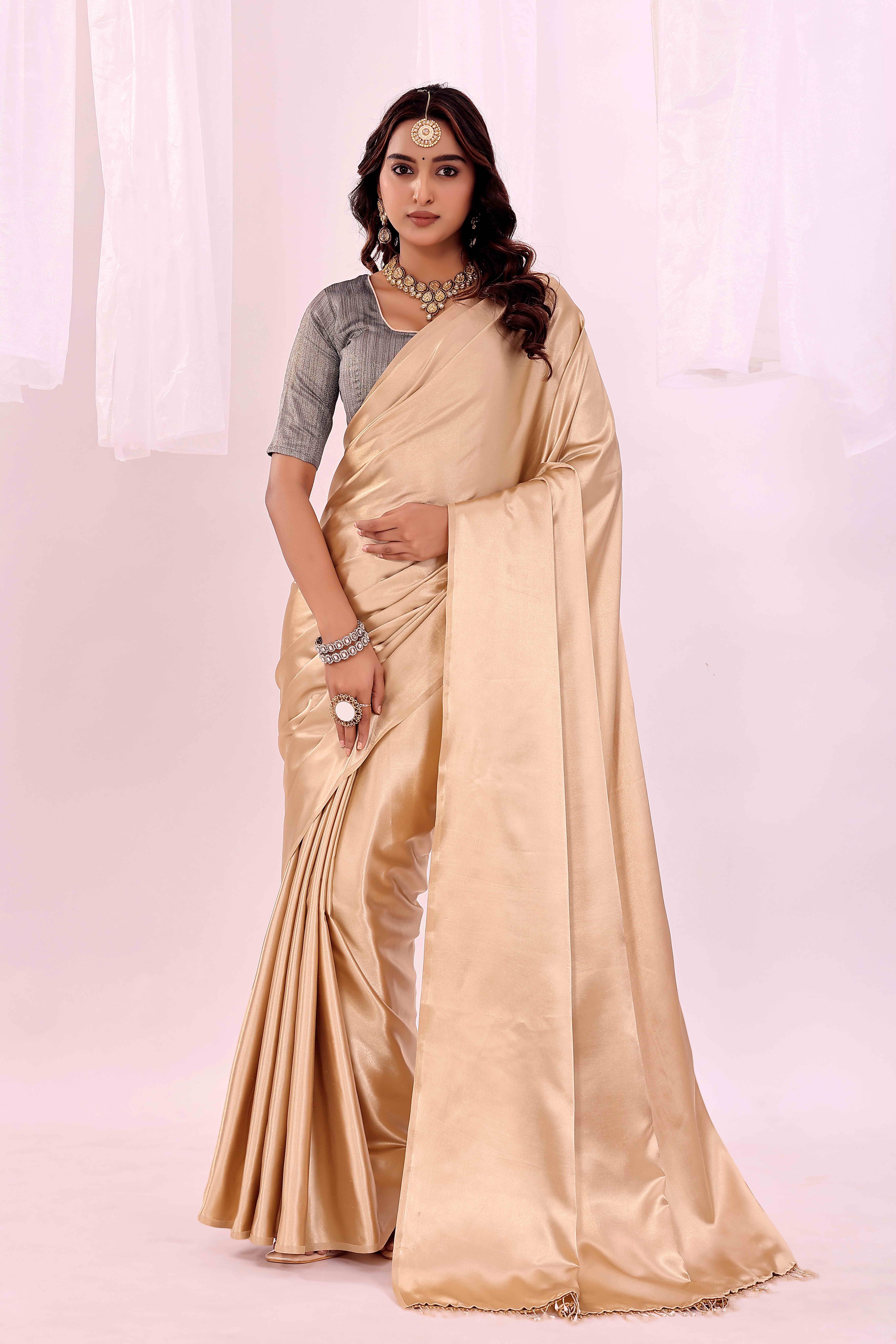 Suali Satin Solid Saree With Unstitched Blouse Piece ( Beige ) Suali Satin Solid Saree With Unstitched Blouse Piece ( Beige )