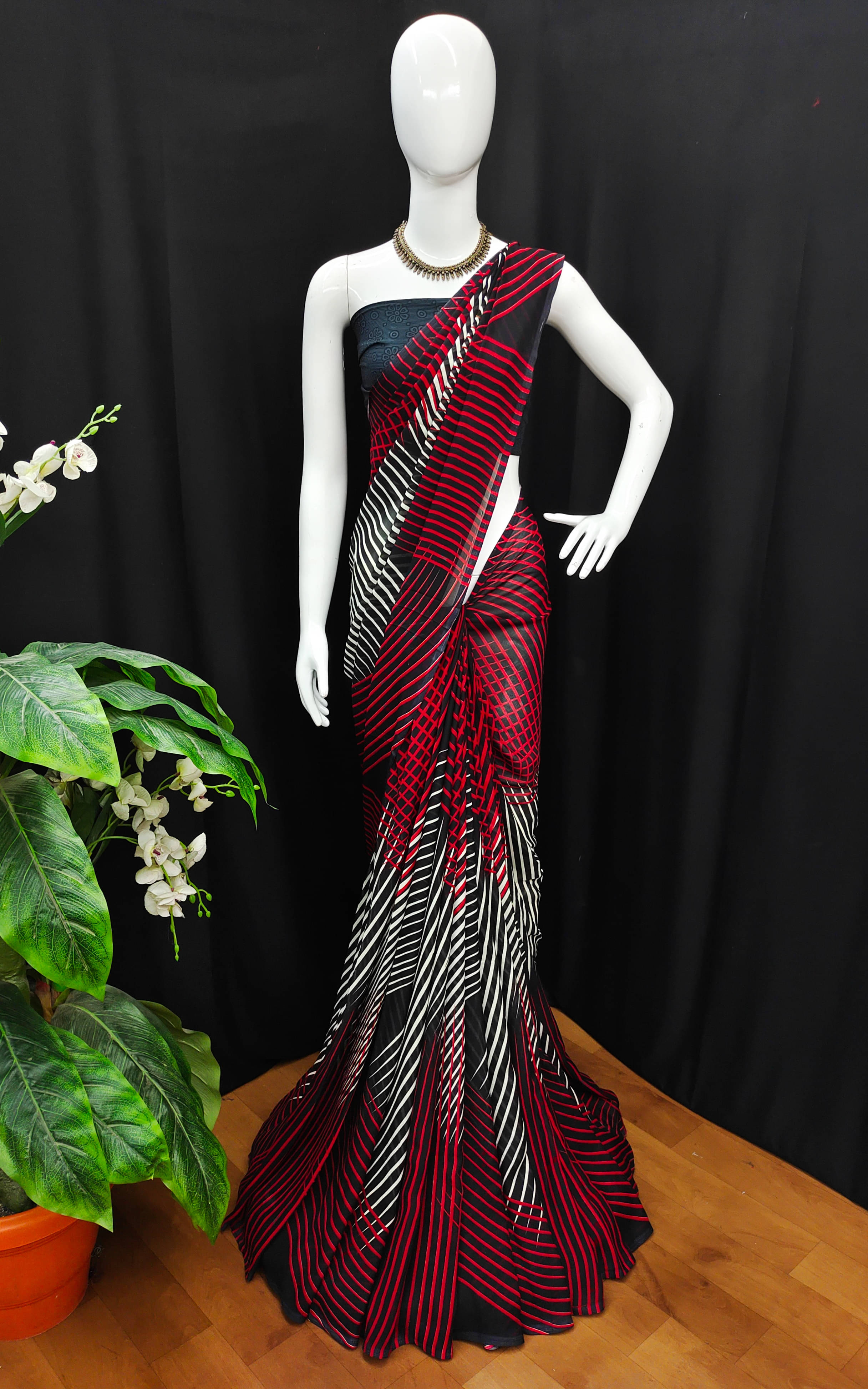 ANAND SAREES Georgette Striped Chanderi saree With Unstitched Blouse Piece ( Black ) ANAND SAREES Georgette Striped Chanderi saree With Unstitched Blouse Piece ( Black )