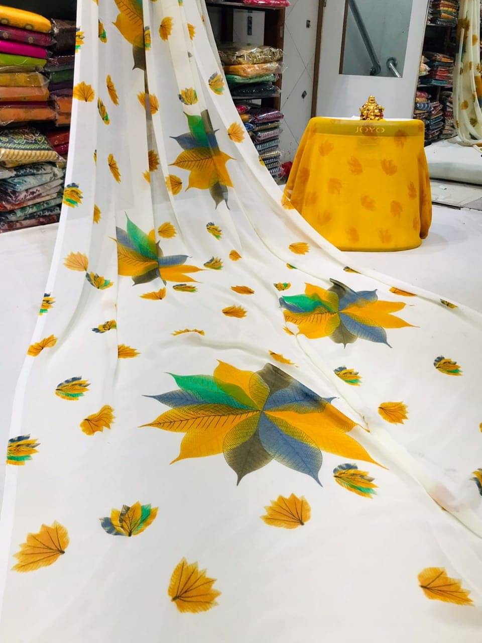     			SHIRODHARI Georgette Printed Saree With Unstitched Blouse Piece ( Yellow )