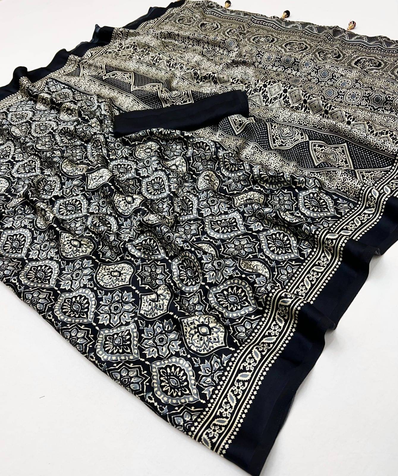 SHIRODHARI Satin Printed Sambalpuri Saree With Unstitched Blouse Piece ( Black ) SHIRODHARI Satin Printed Sambalpuri Saree With Unstitched Blouse Piece ( Black )