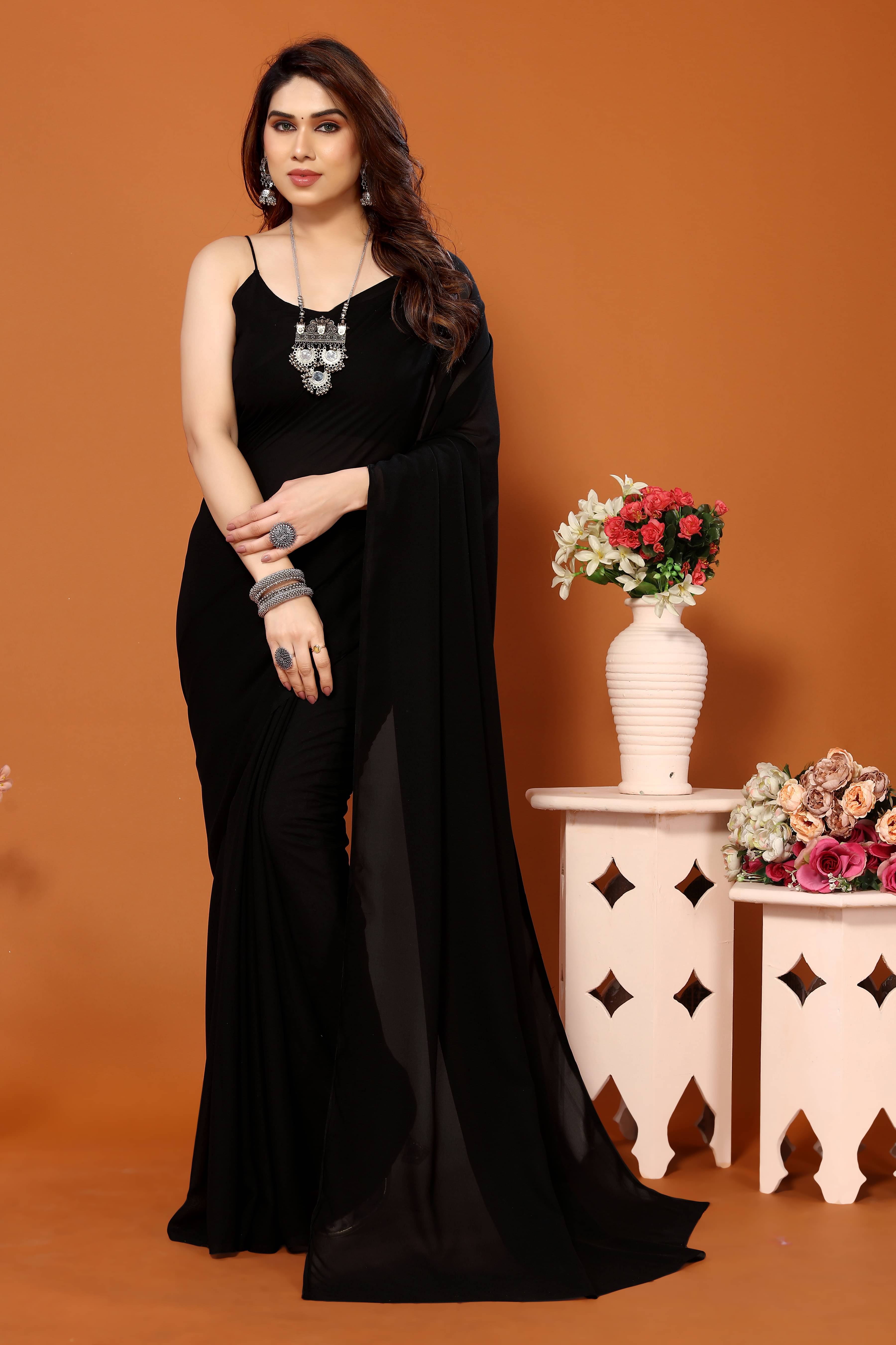 ANAND SAREES Georgette Solid Kasavu Saree With Unstitched Blouse Piece ( Black ) ANAND SAREES Georgette Solid Kasavu Saree With Unstitched Blouse Piece ( Black )