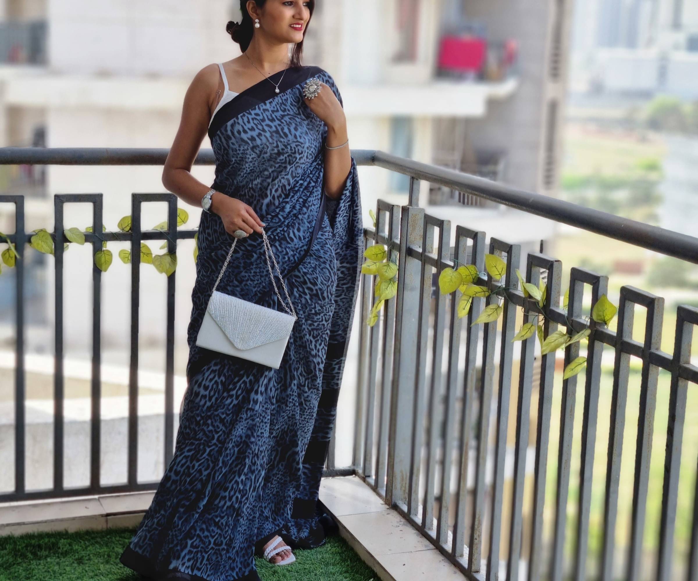 ANAND SAREES Georgette Printed Saree With Unstitched Blouse Piece ( Light Blue ) ANAND SAREES Georgette Printed Saree With Unstitched Blouse Piece ( Light Blue )